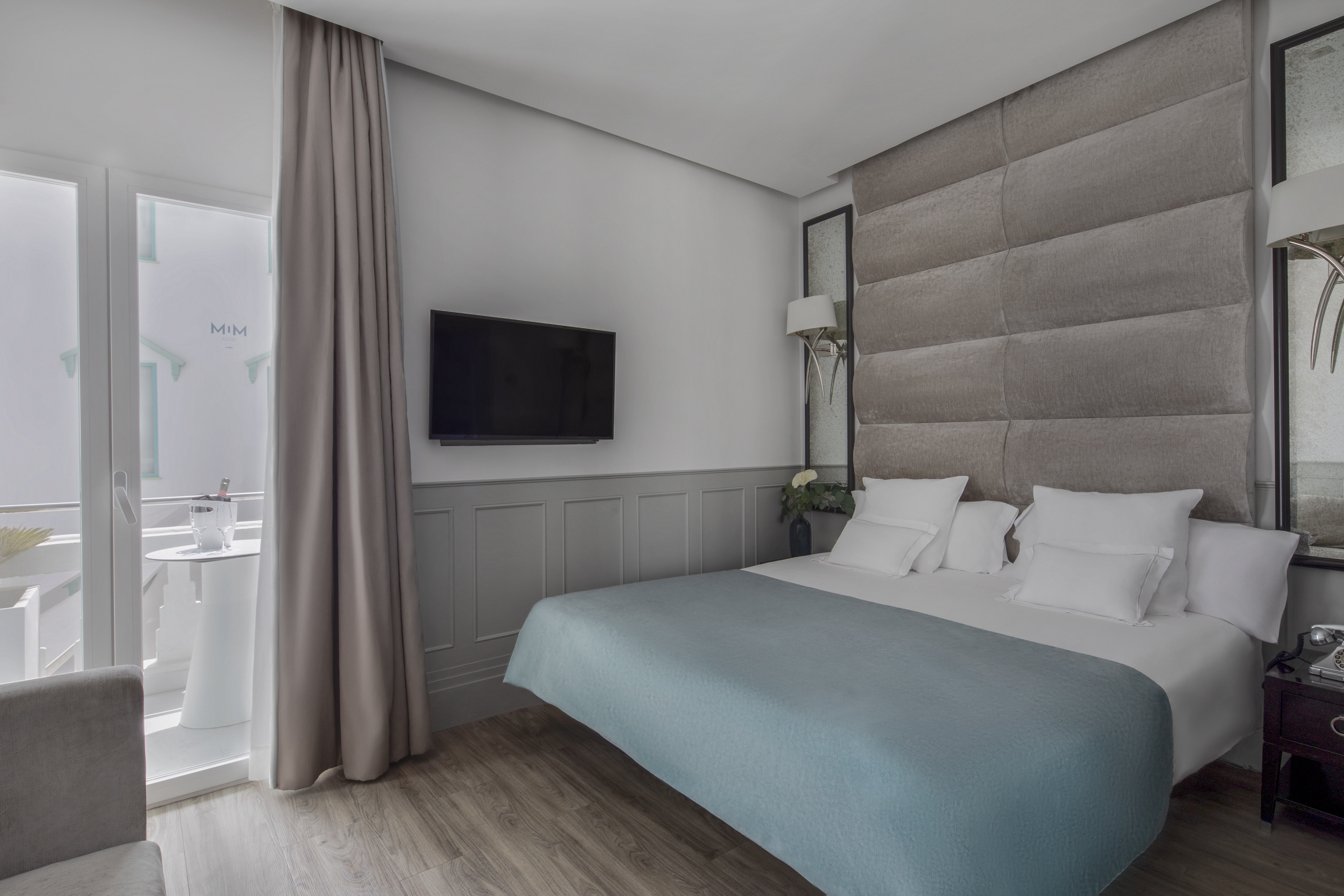a bed with a tv in a room