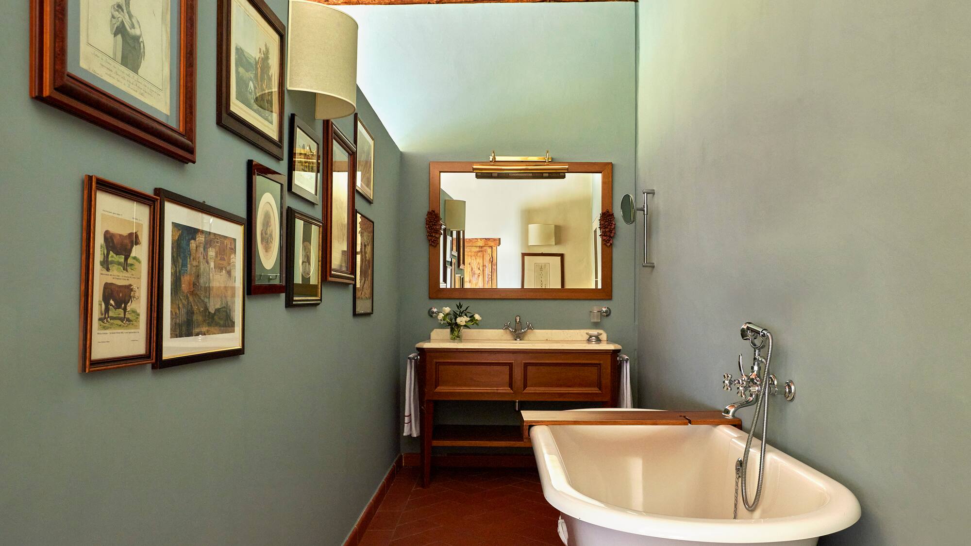 a bathroom with a tub and sink