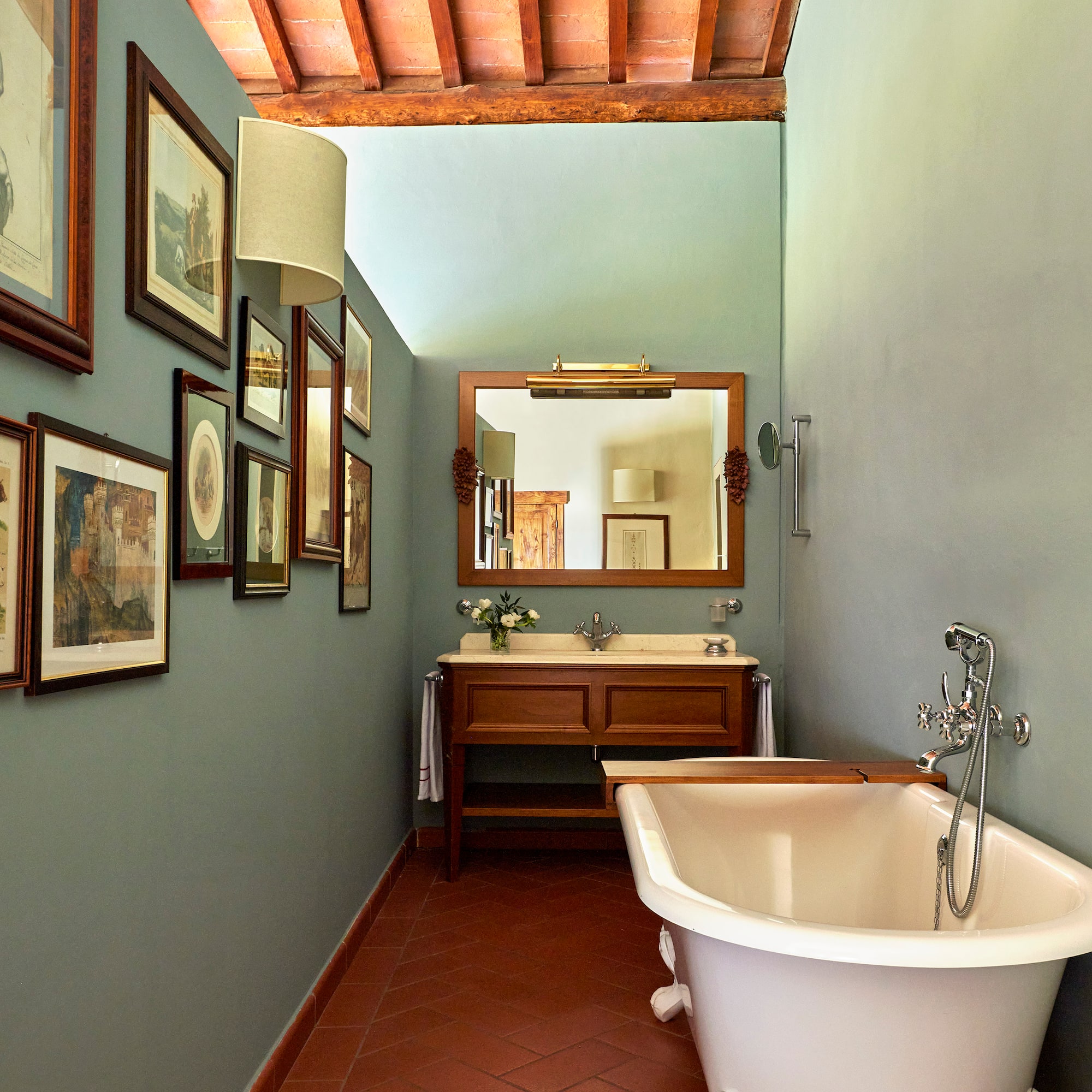 a bathroom with a tub and sink