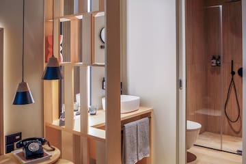 a bathroom with a wood partition