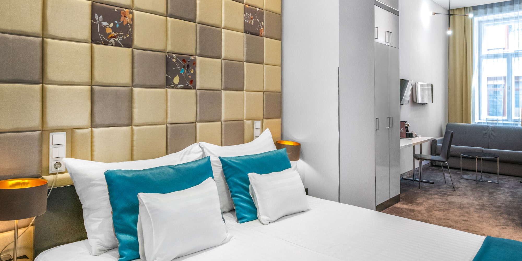 a bed with pillows in a room