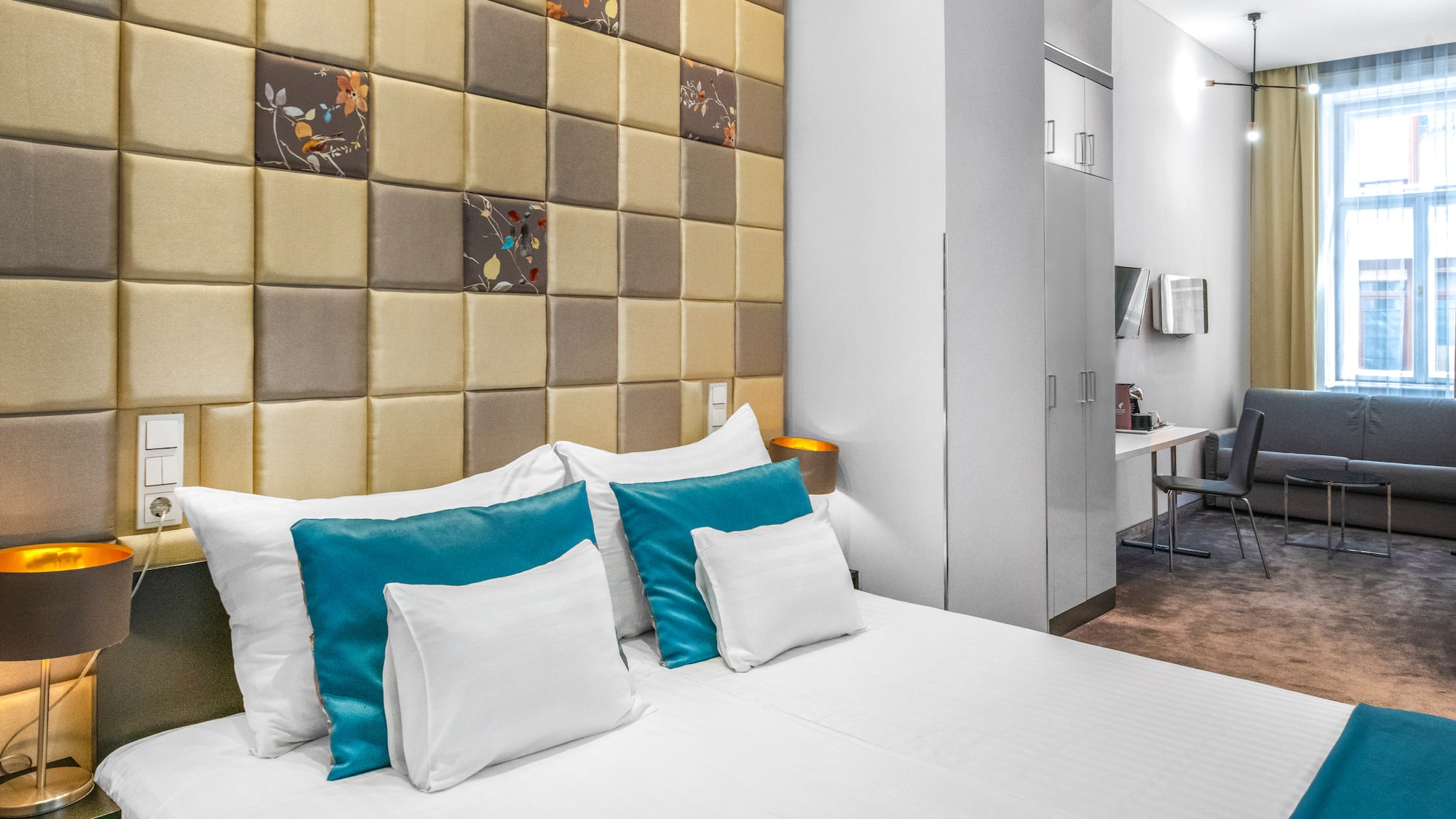 a bed with pillows in a room