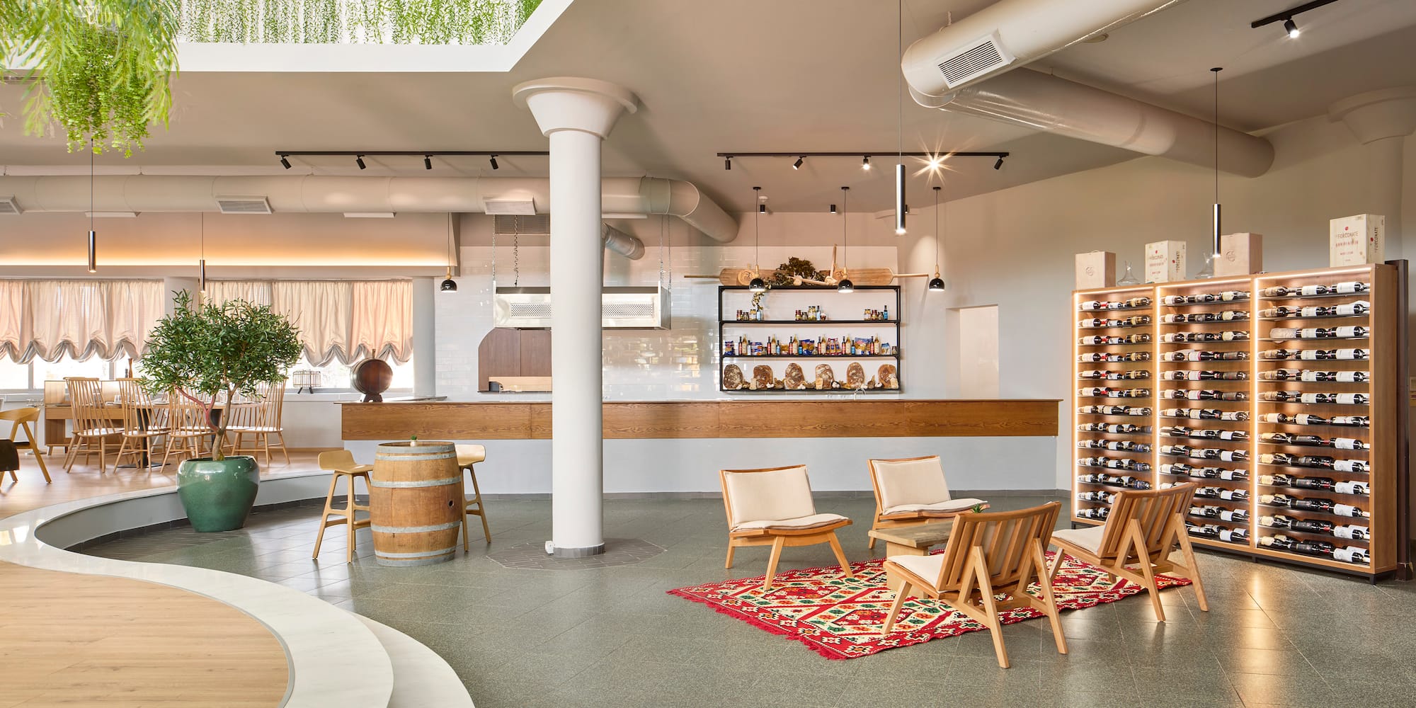 a room with chairs and a wine rack