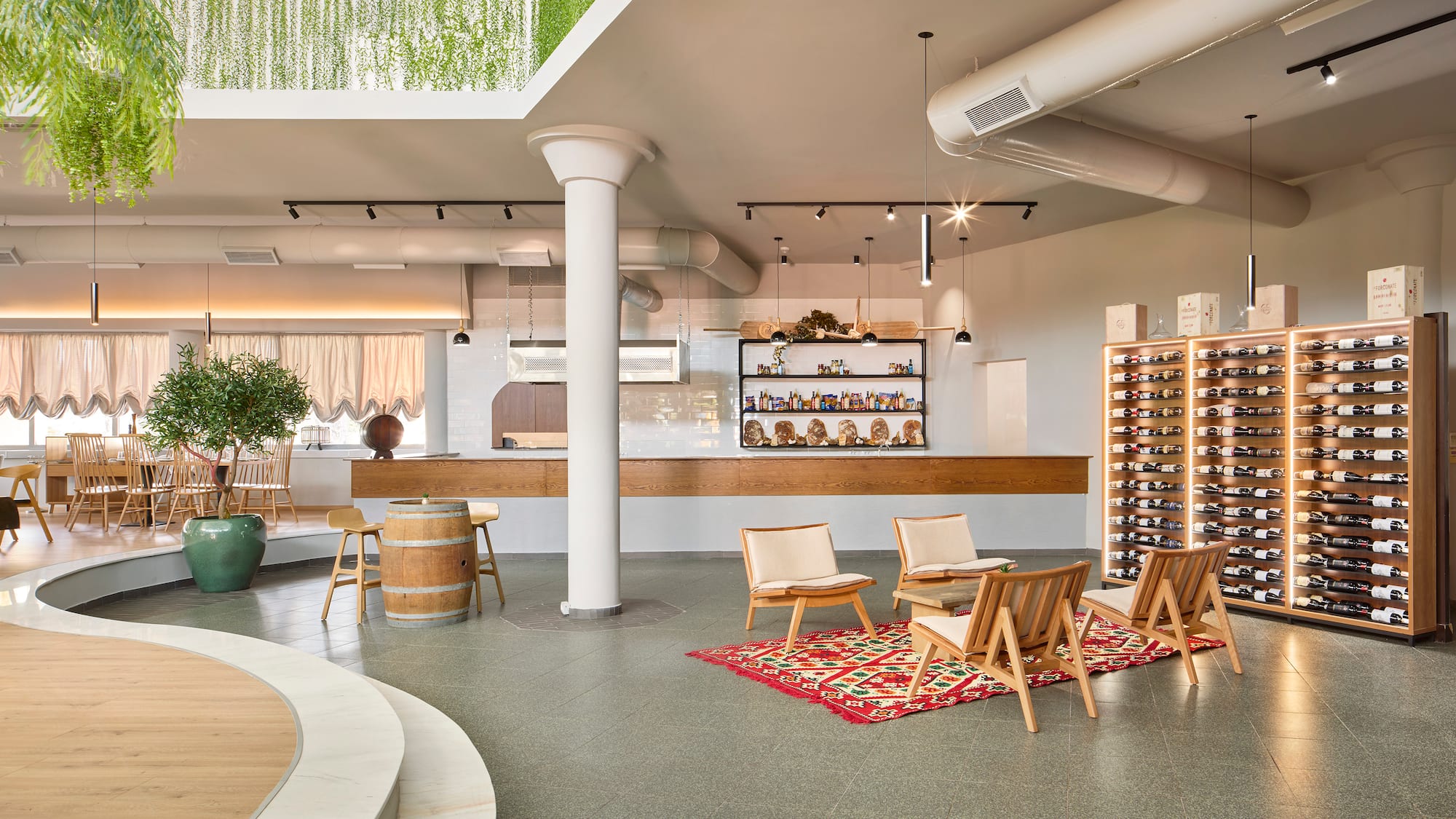 a room with chairs and a wine rack