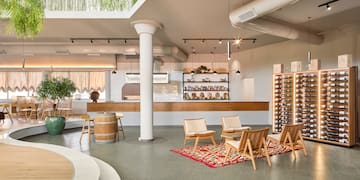 a room with chairs and a wine rack