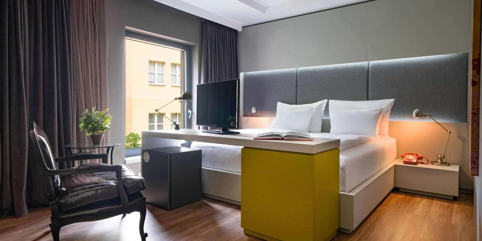 a room with a bed and a desk