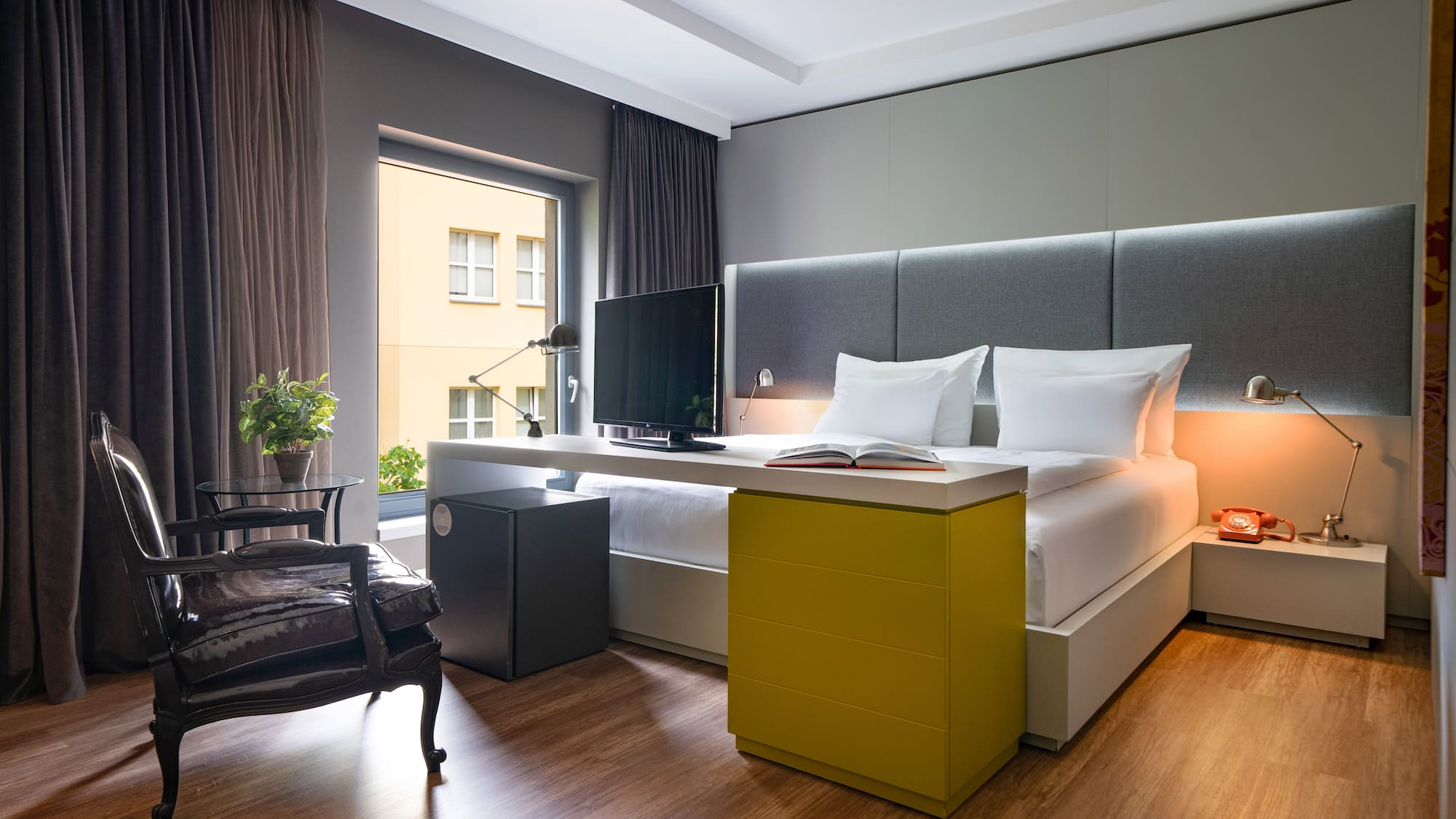 a room with a bed and a desk