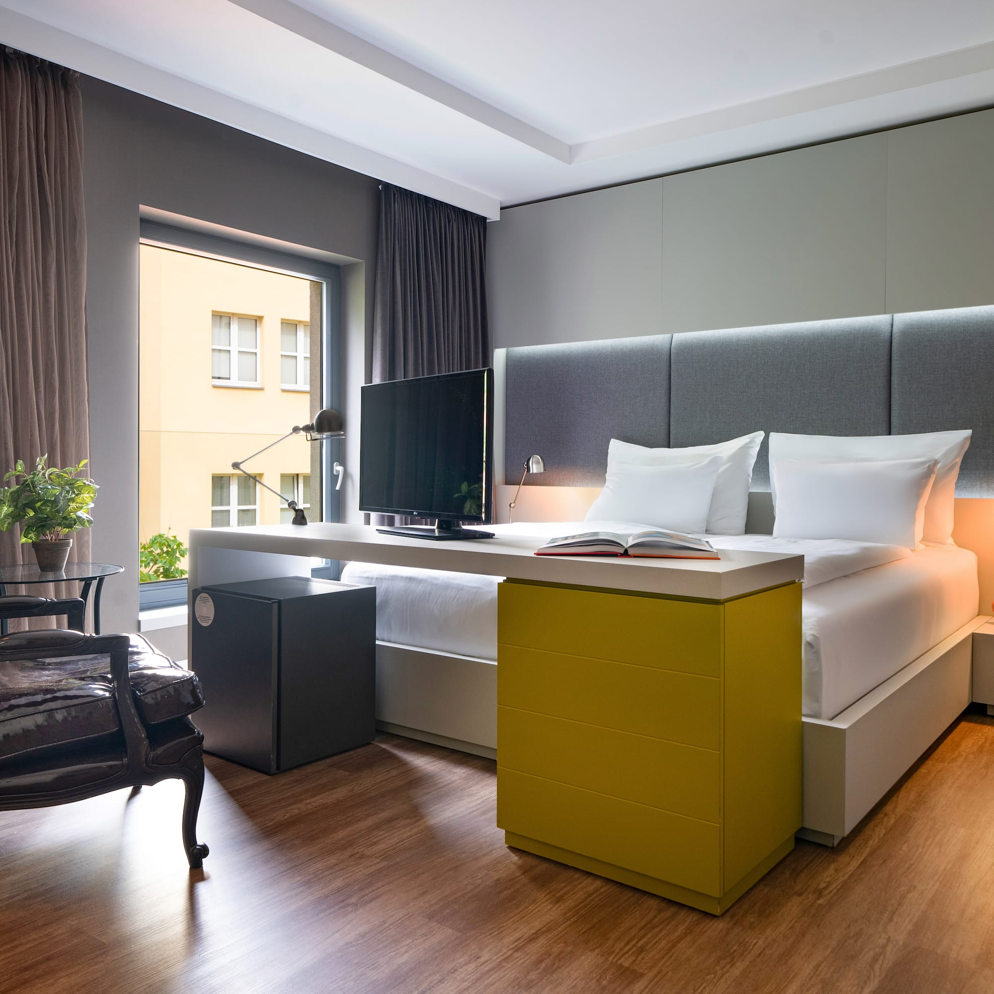 a room with a bed and a desk