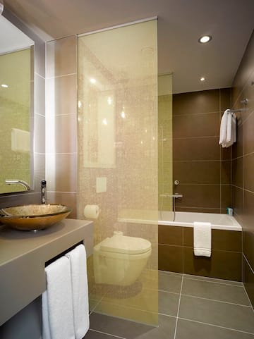 a bathroom with a sink and shower curtain