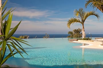 a pool with palm trees and a bar