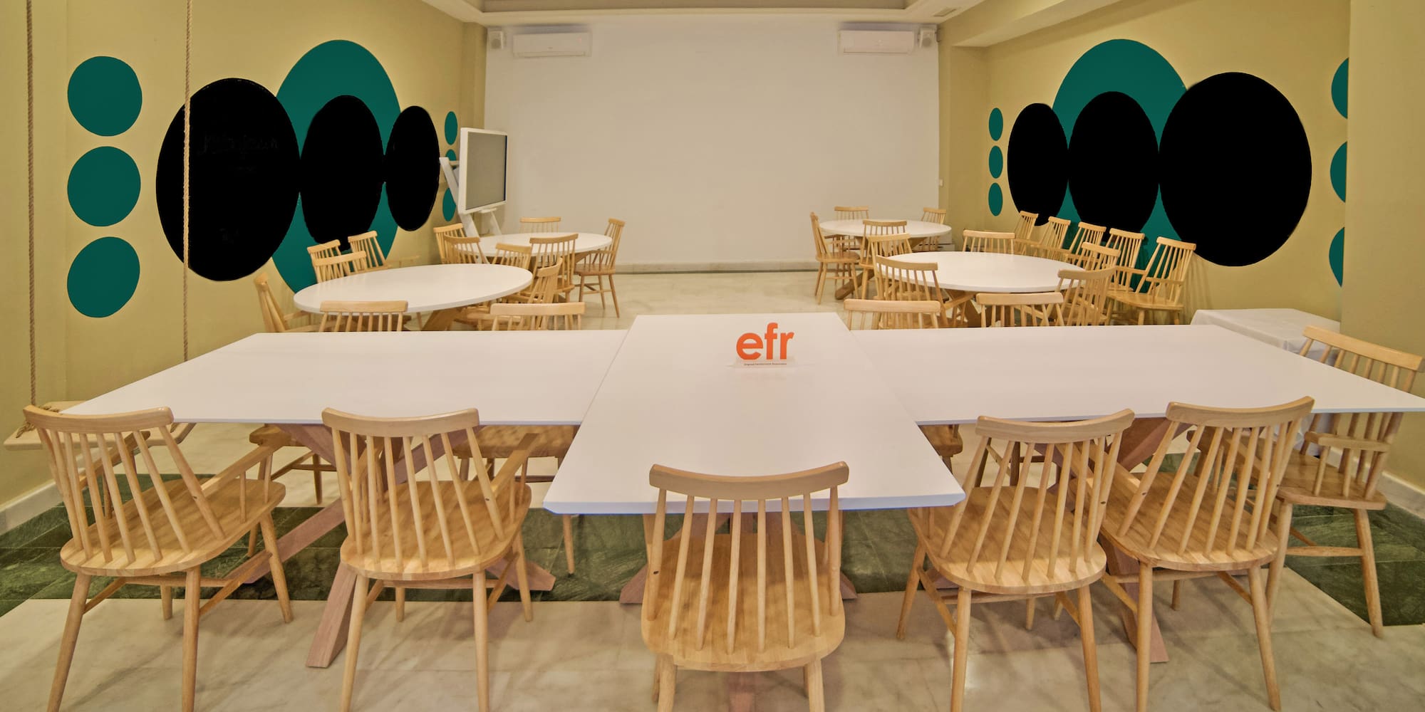 a room with tables and chairs