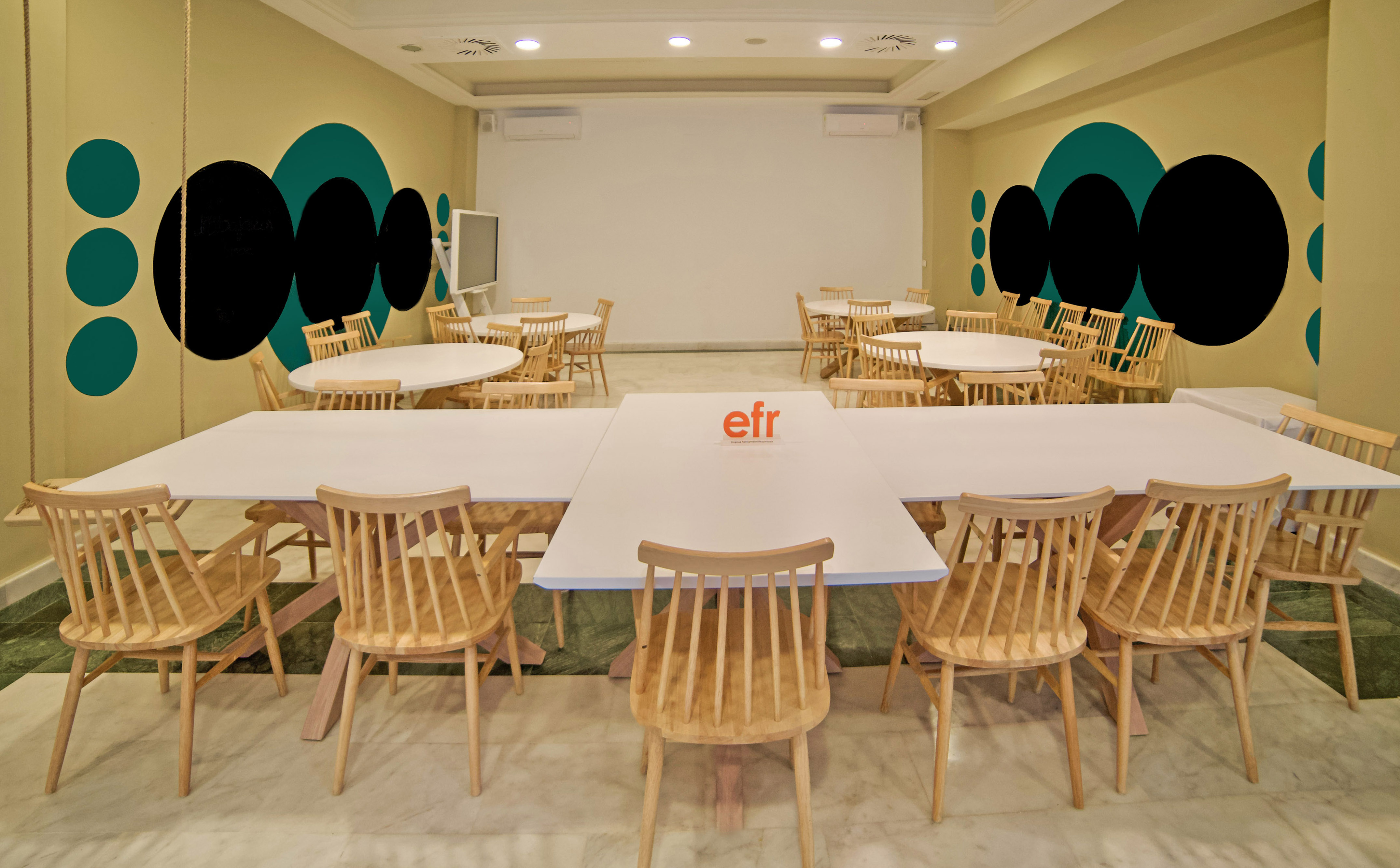 a room with tables and chairs