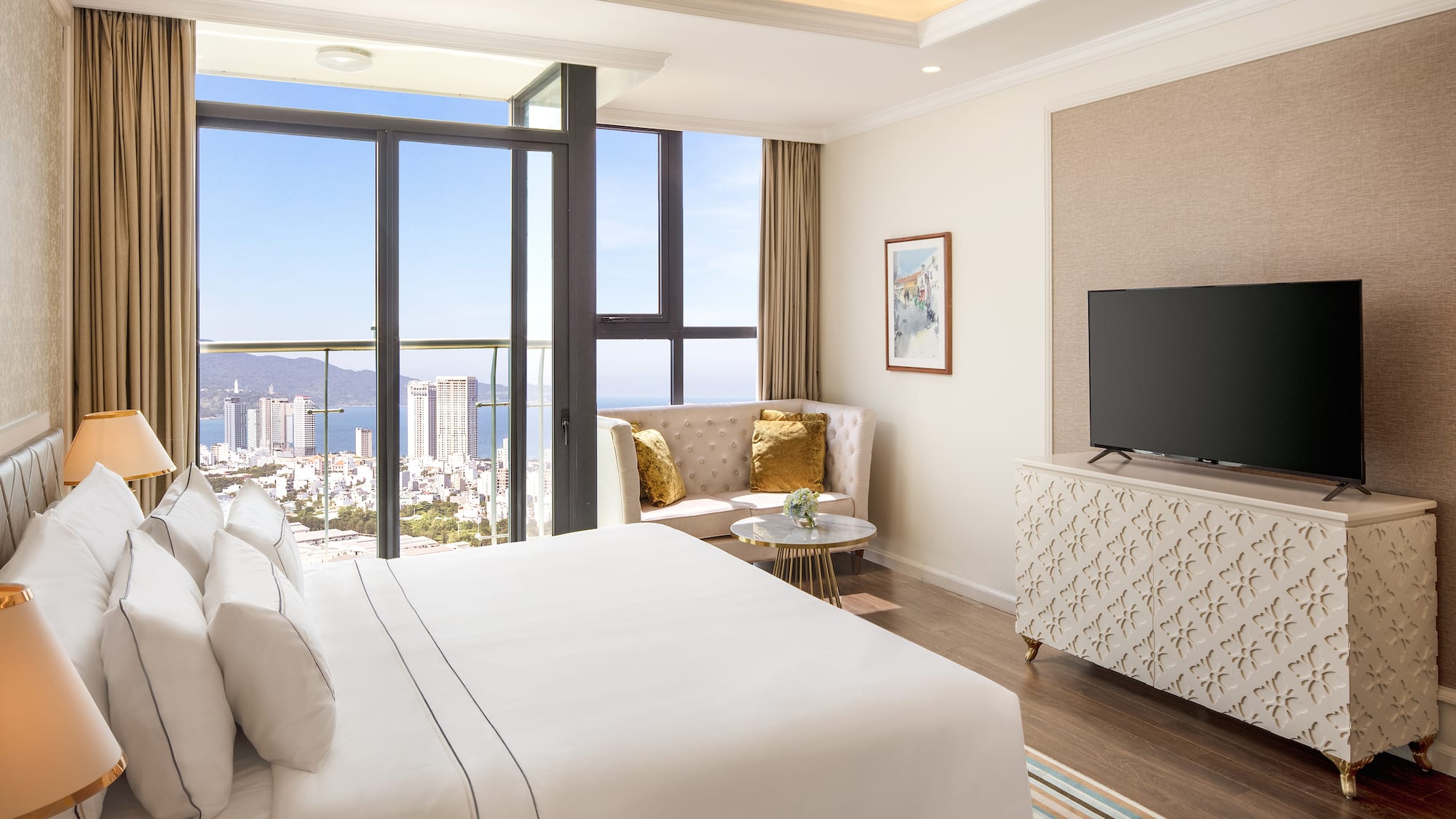 a bedroom with a television and a view of the city