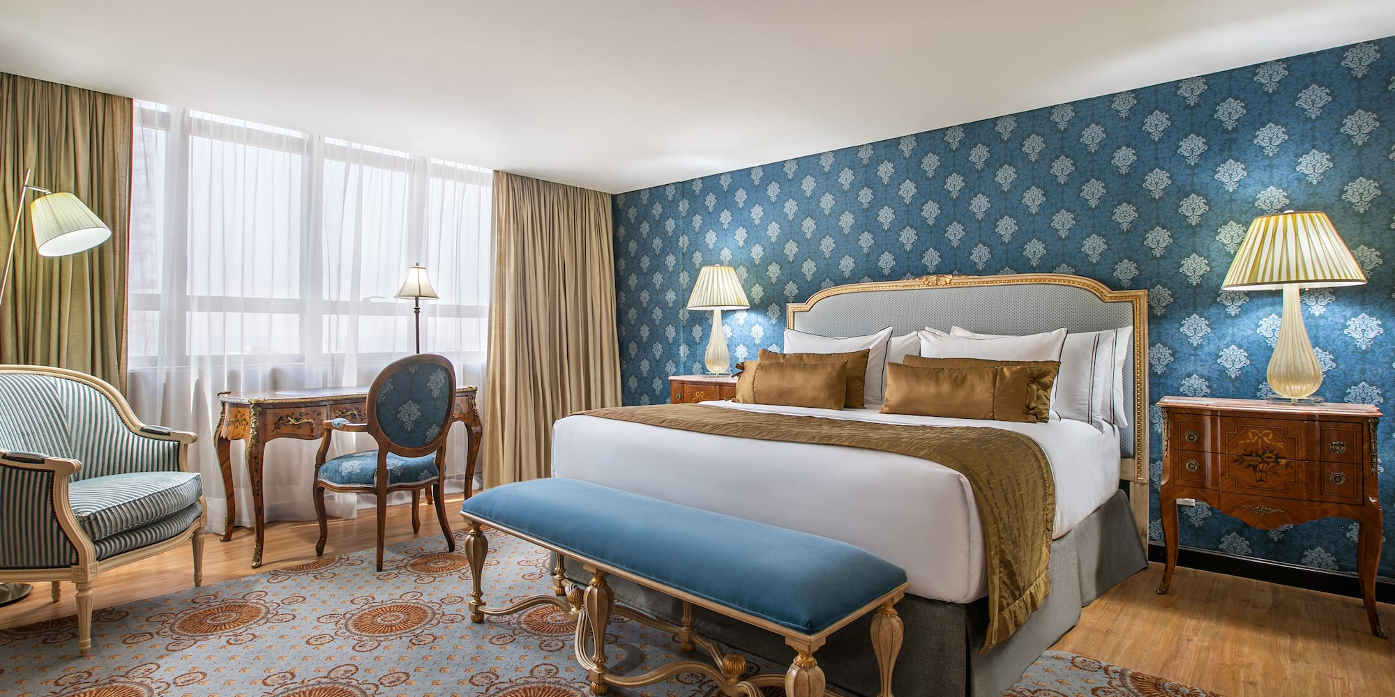 a bedroom with a bed and a desk