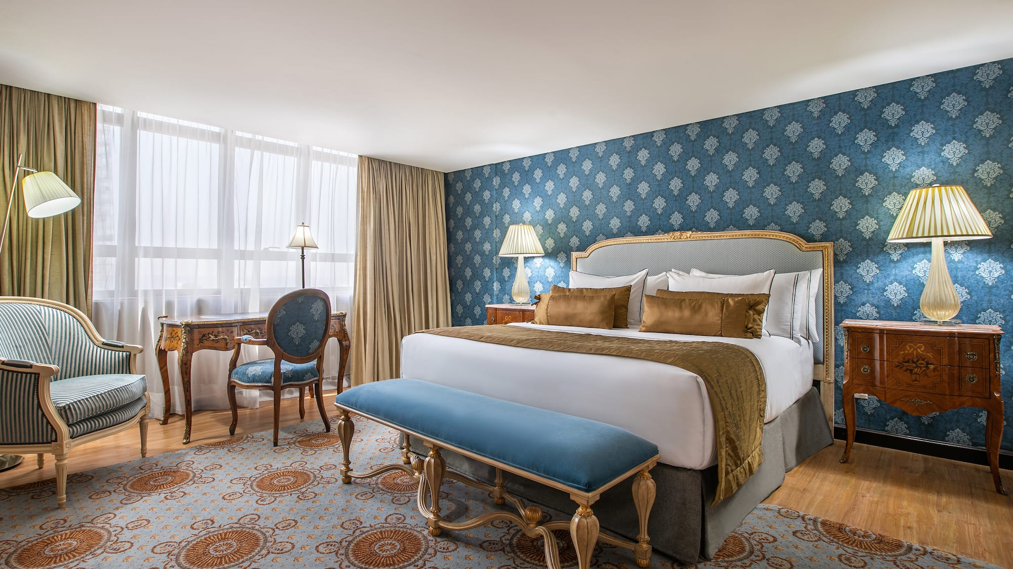 a bedroom with a bed and a desk