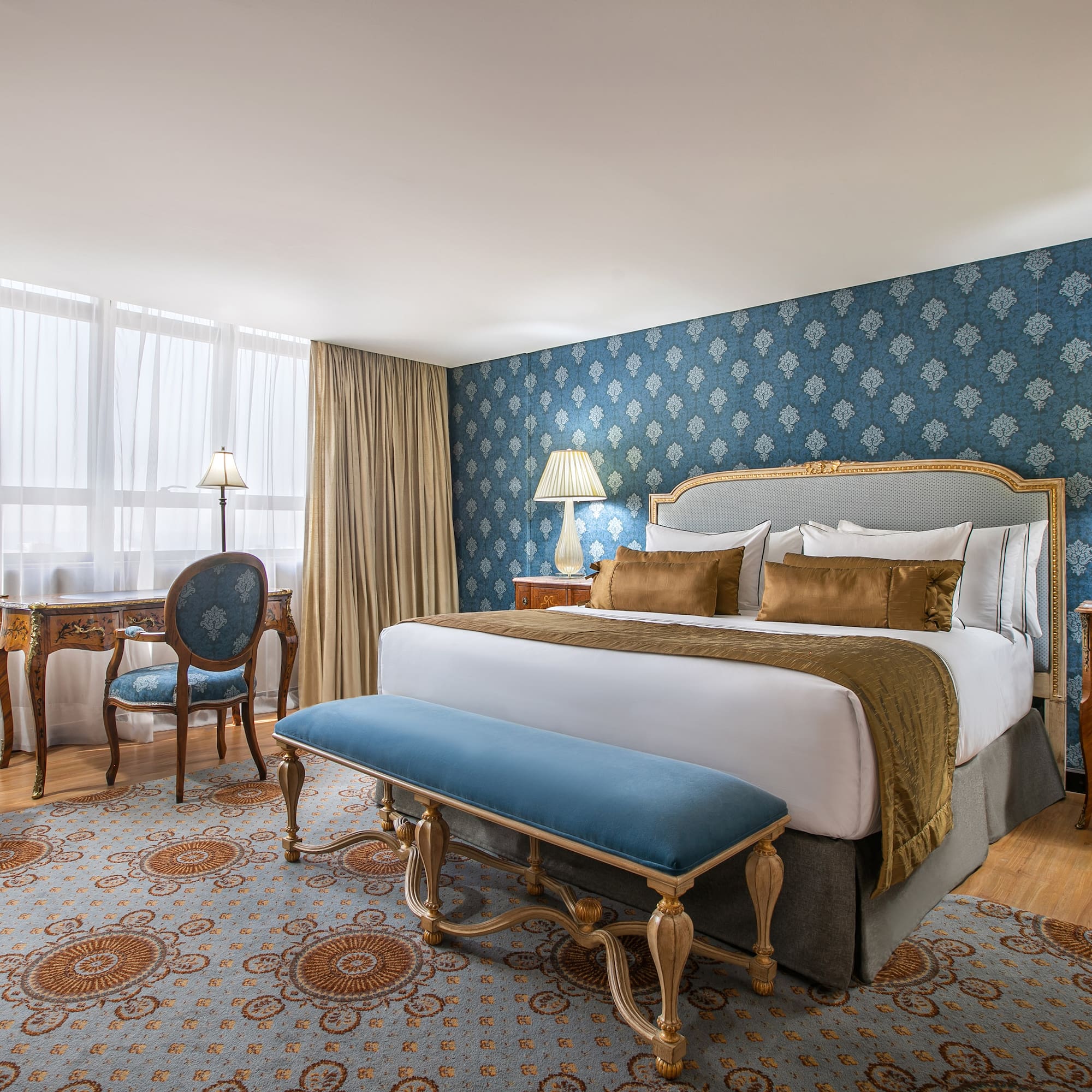 a bedroom with a bed and a desk