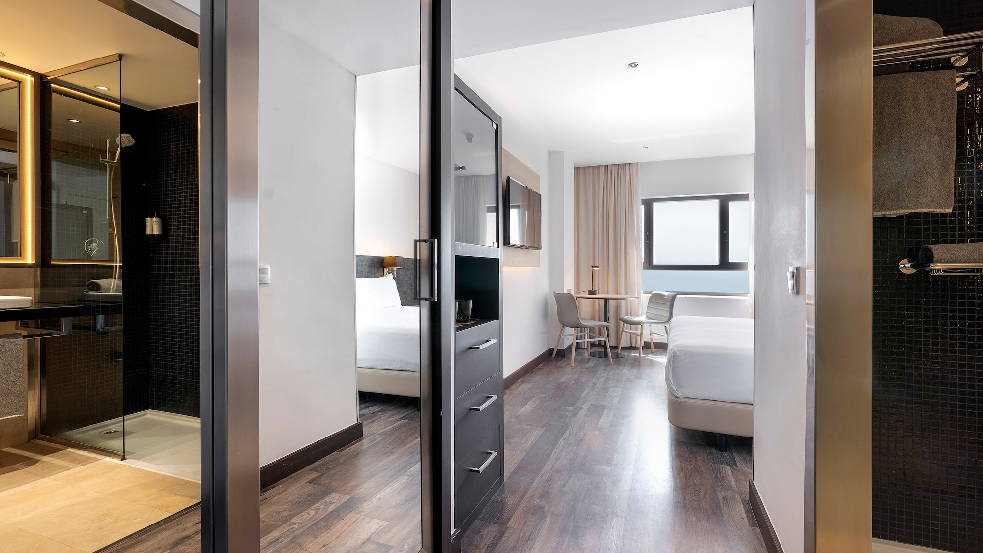 a room with a mirror door and a bed