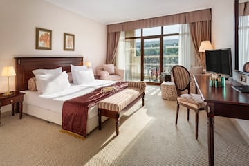 a bedroom with a bed and a table