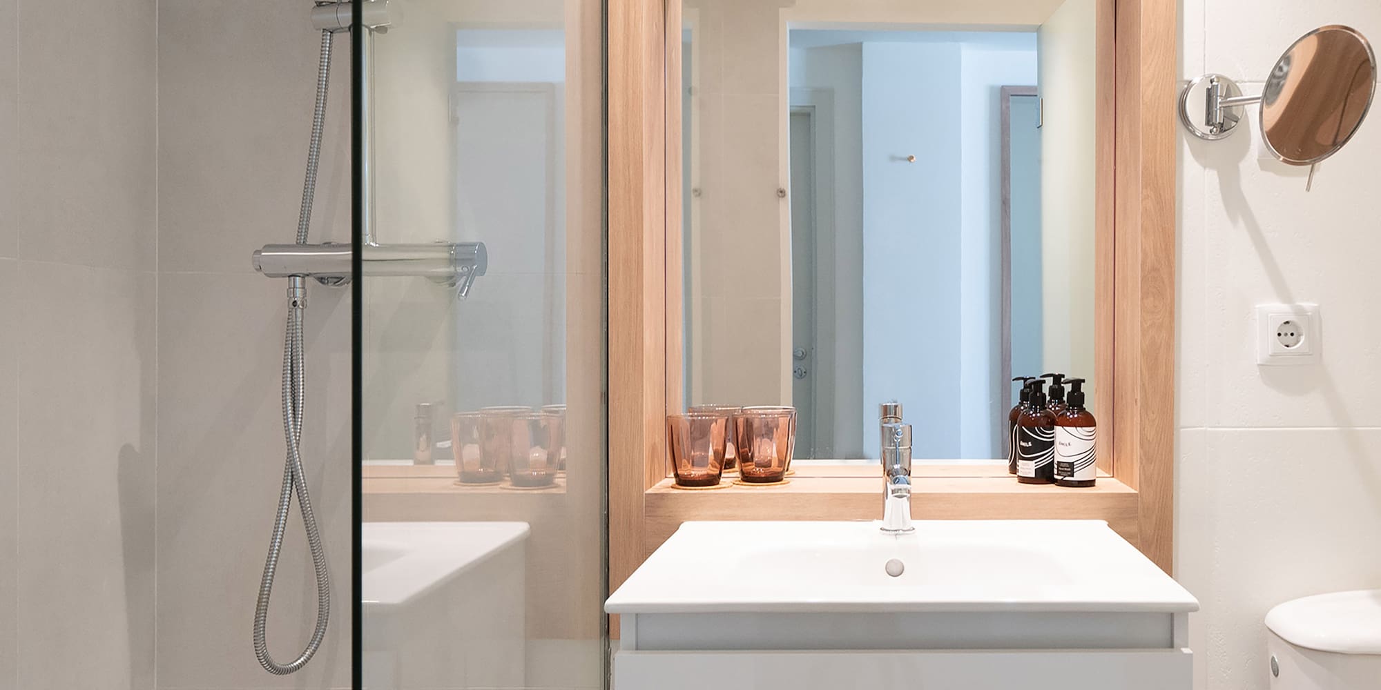 a bathroom with a mirror and sink