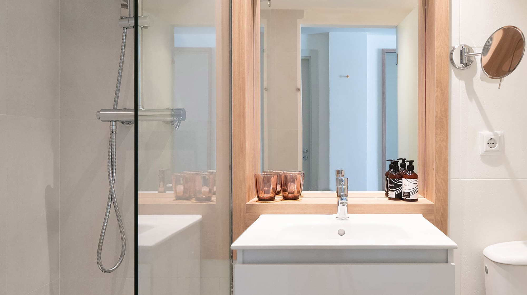 a bathroom with a mirror and sink