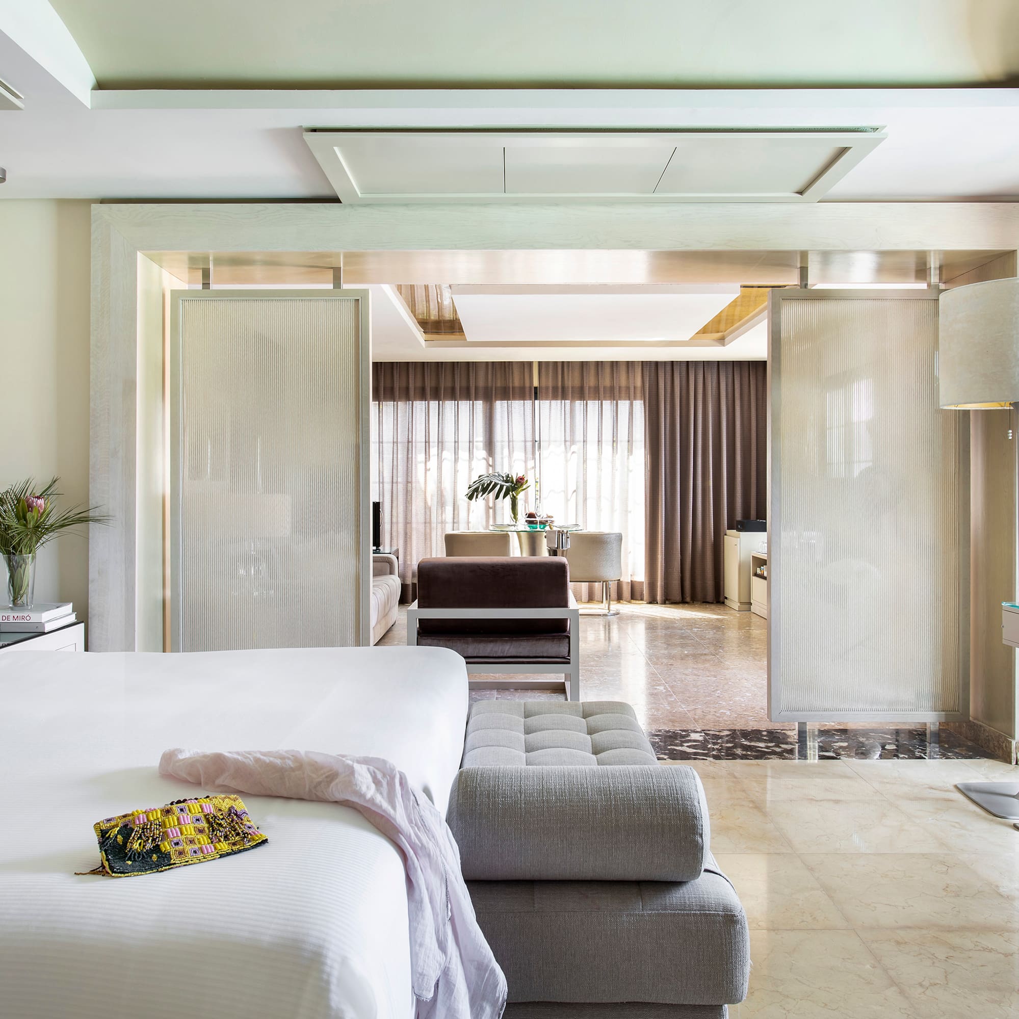 a bedroom with a bed and a couch