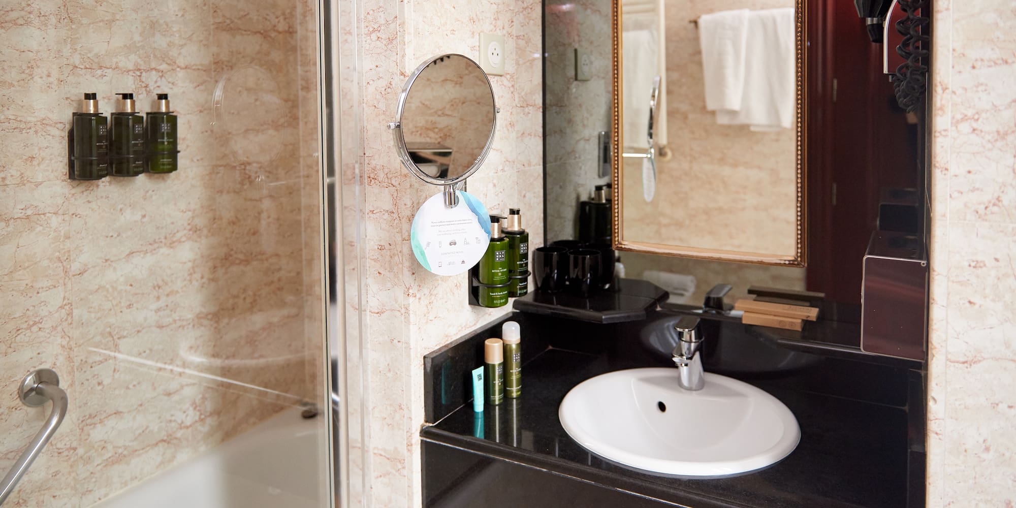 a bathroom with a mirror and sink