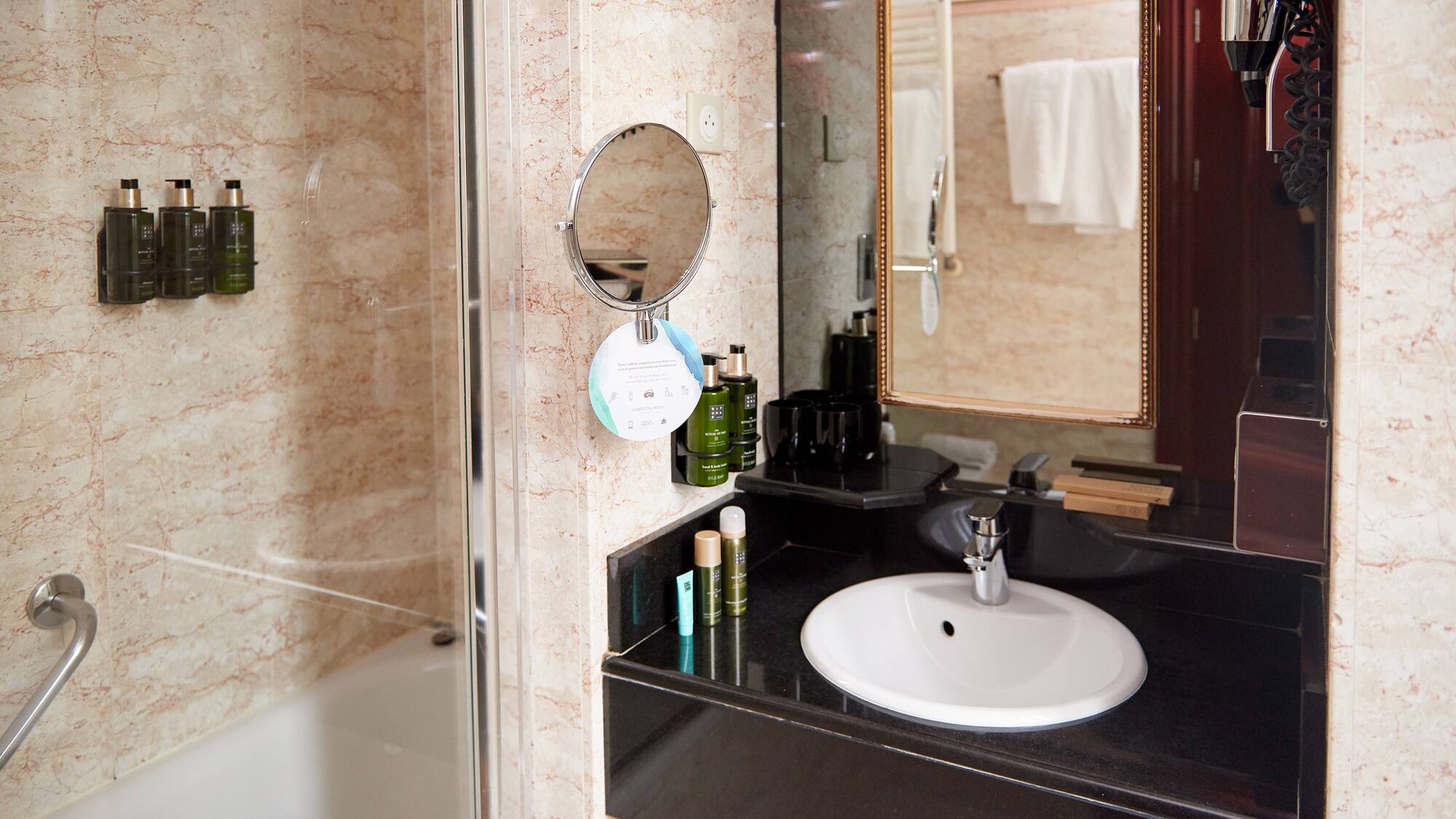 a bathroom with a mirror and sink