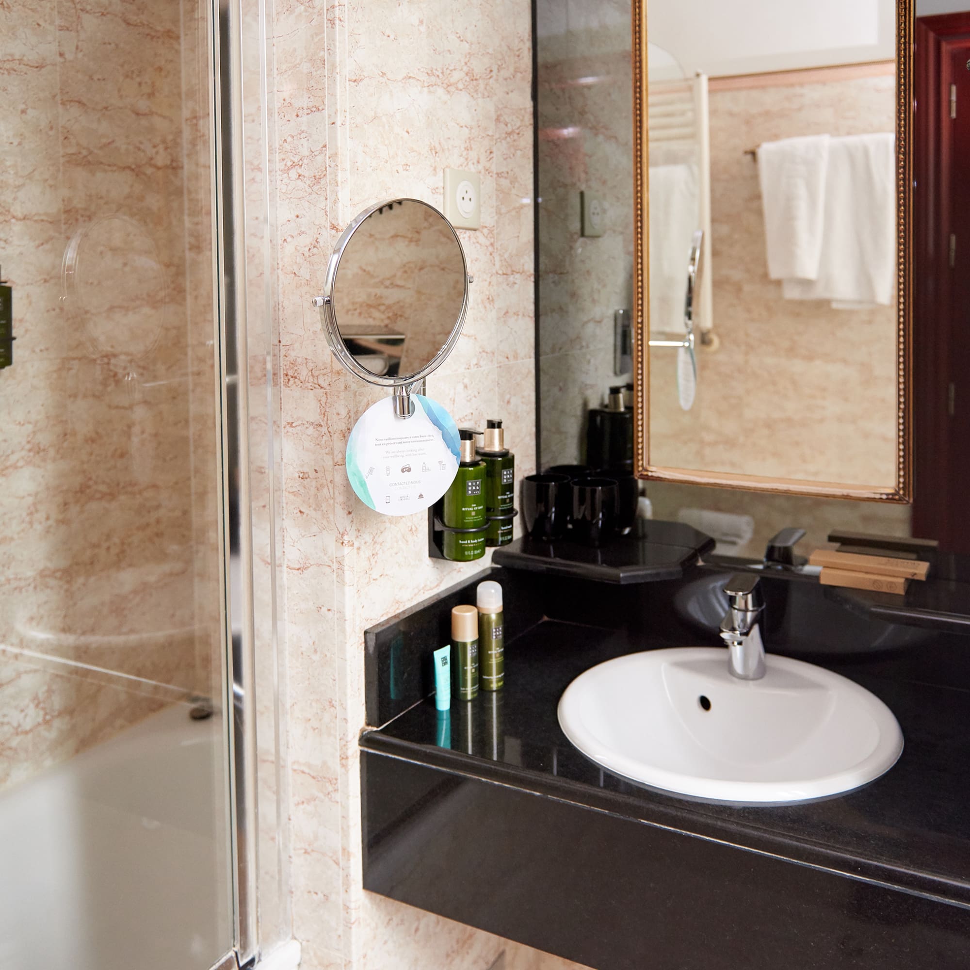 a bathroom with a mirror and sink