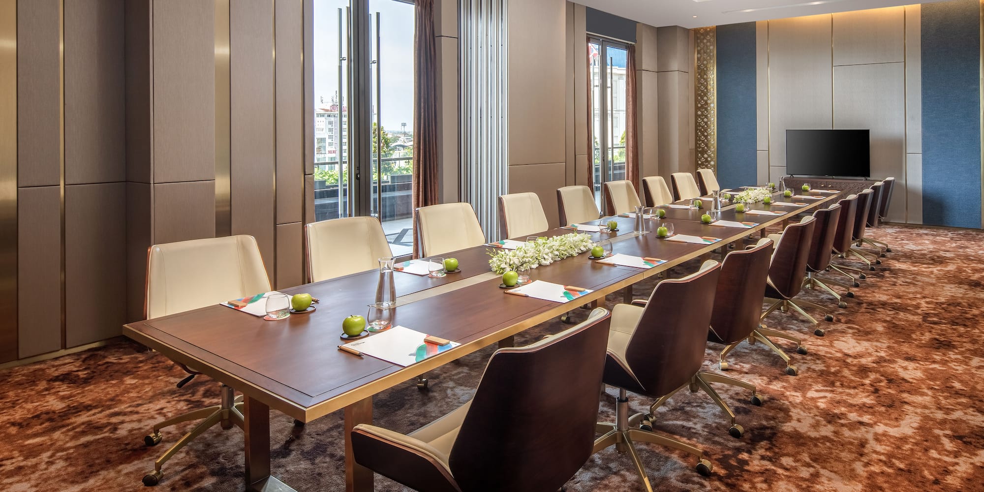 a conference room with a long table and chairs