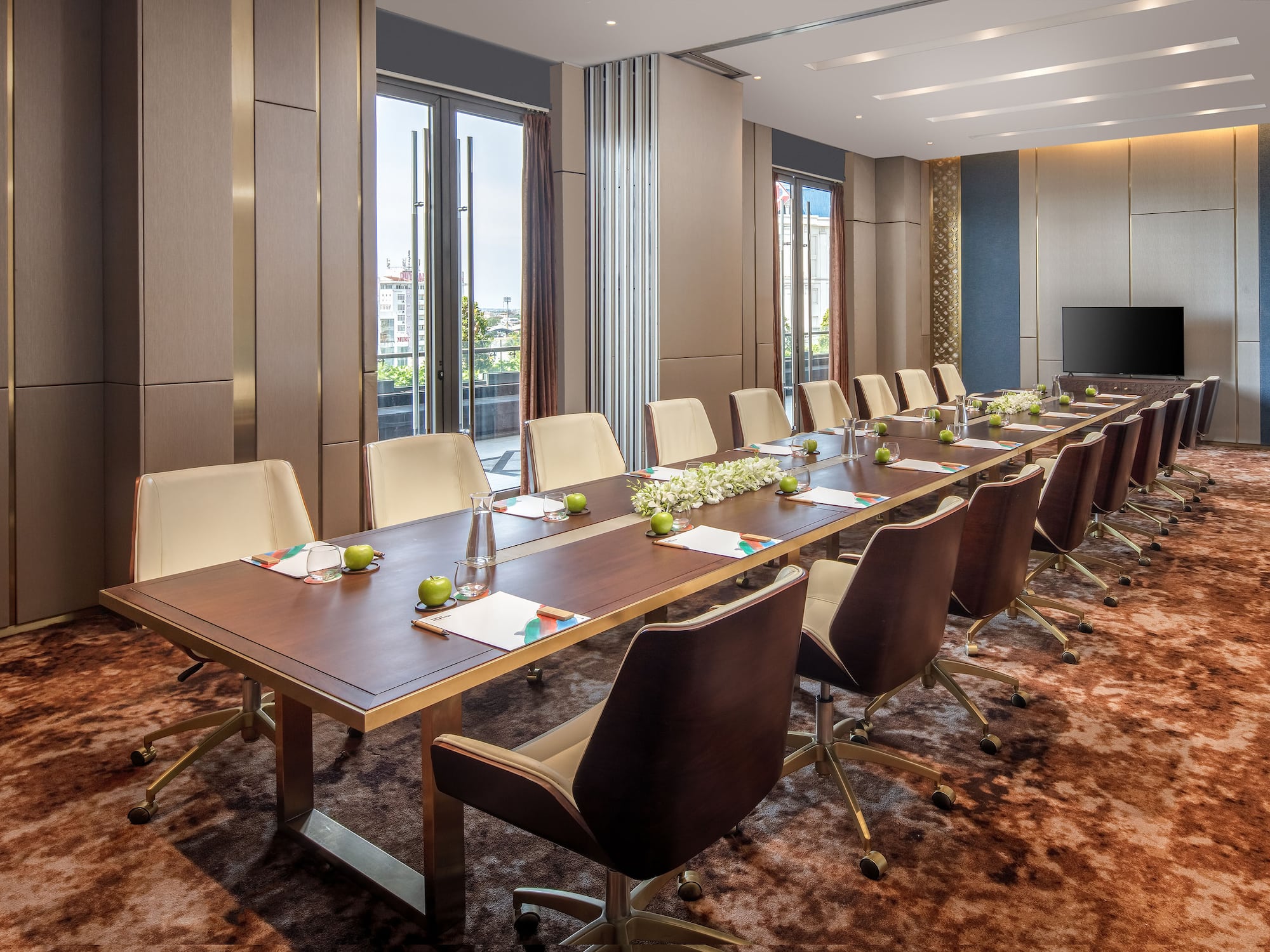a conference room with a long table and chairs