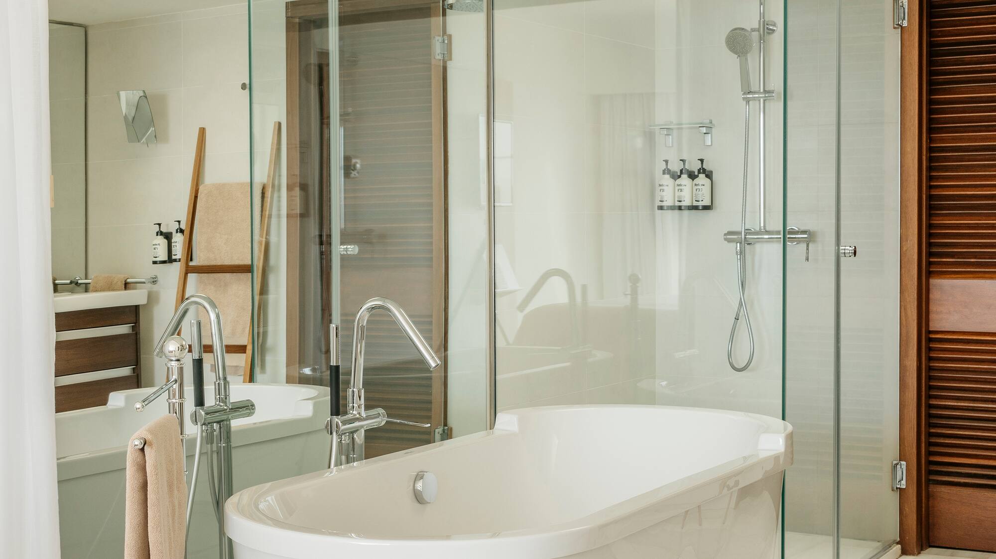 a bathroom with a tub and shower