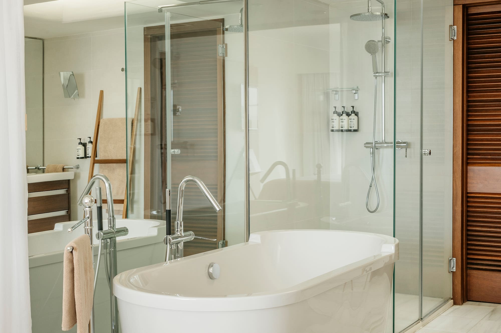a bathroom with a tub and shower