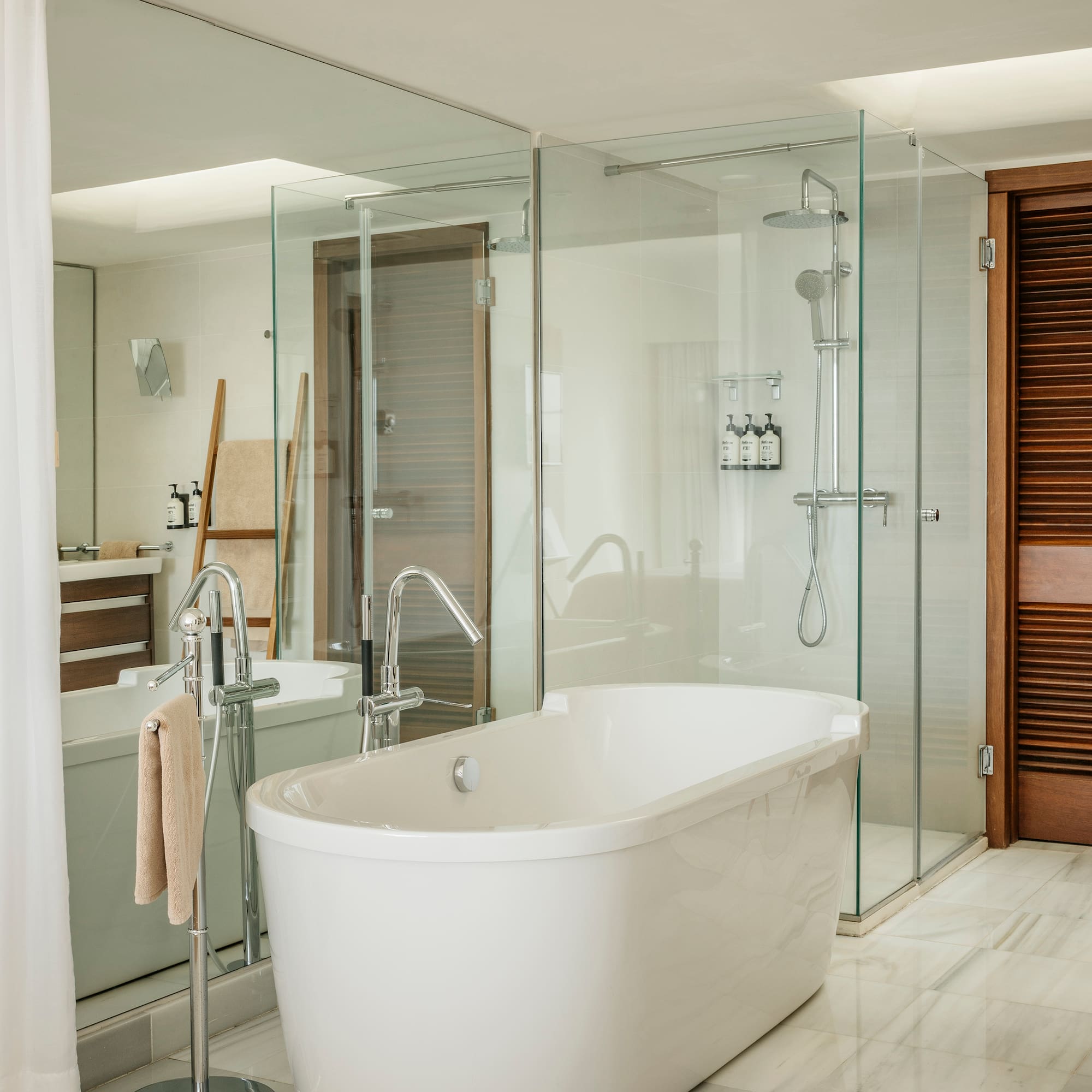 a bathroom with a tub and shower