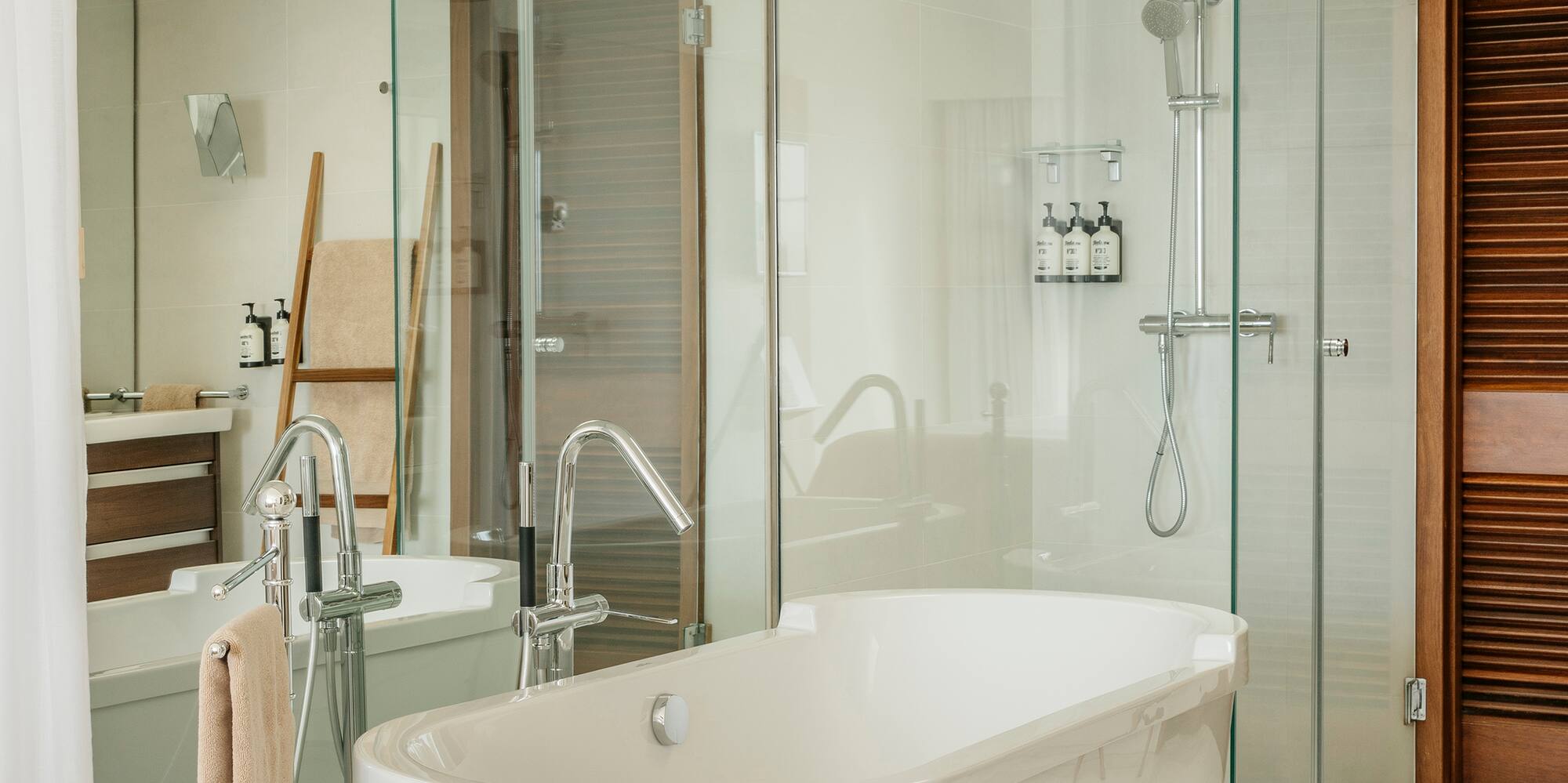 a bathroom with a tub and shower