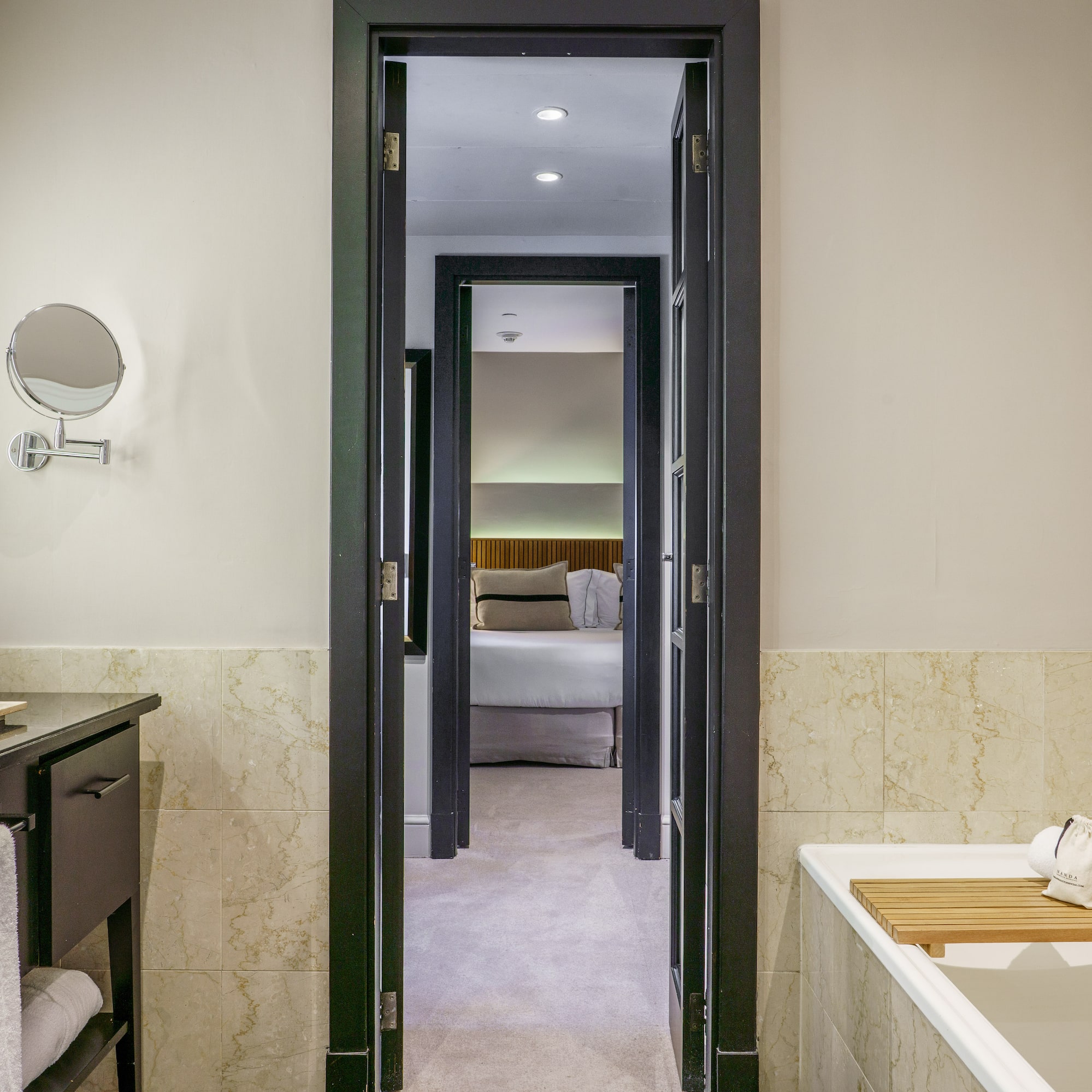a bathroom with a bathtub and a mirror