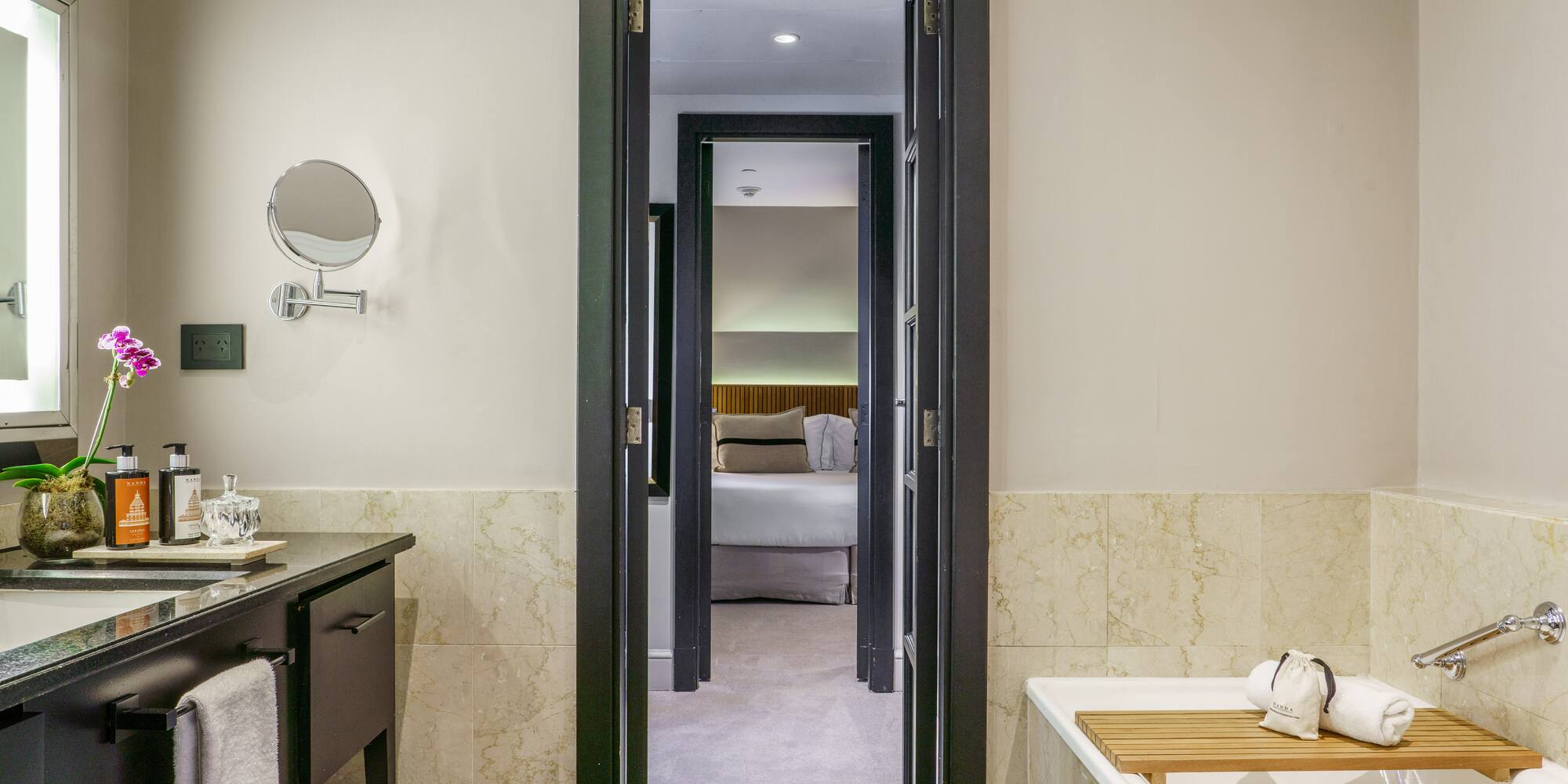 a bathroom with a bathtub and a mirror