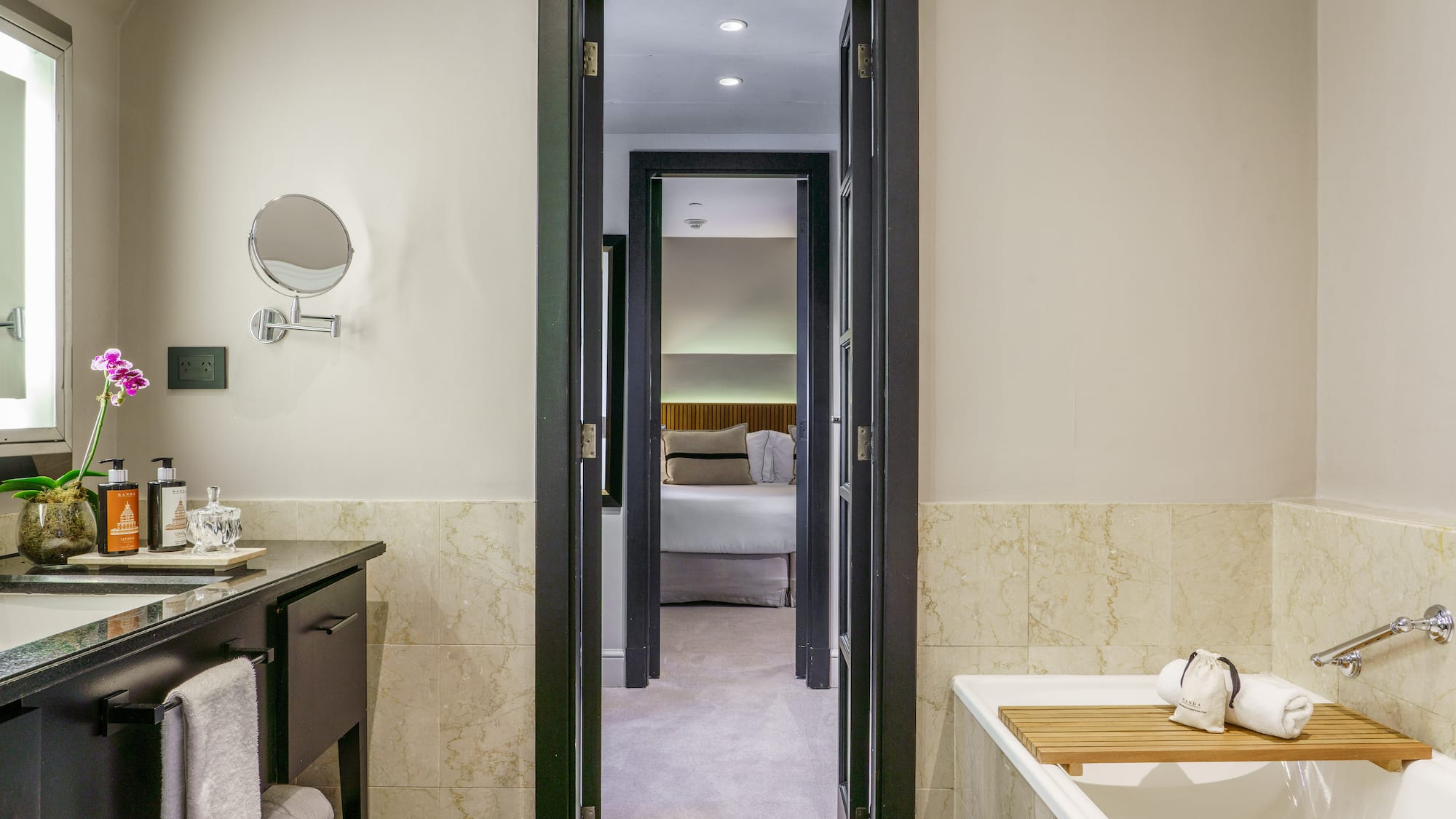 a bathroom with a bathtub and a mirror