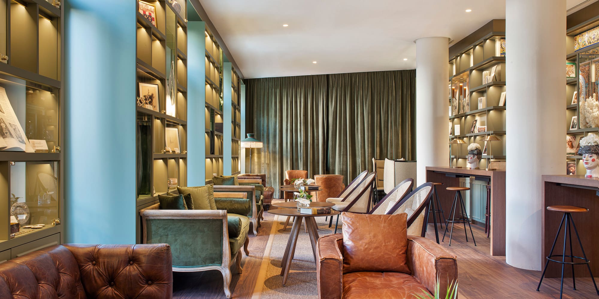 a room with a couch and chairs