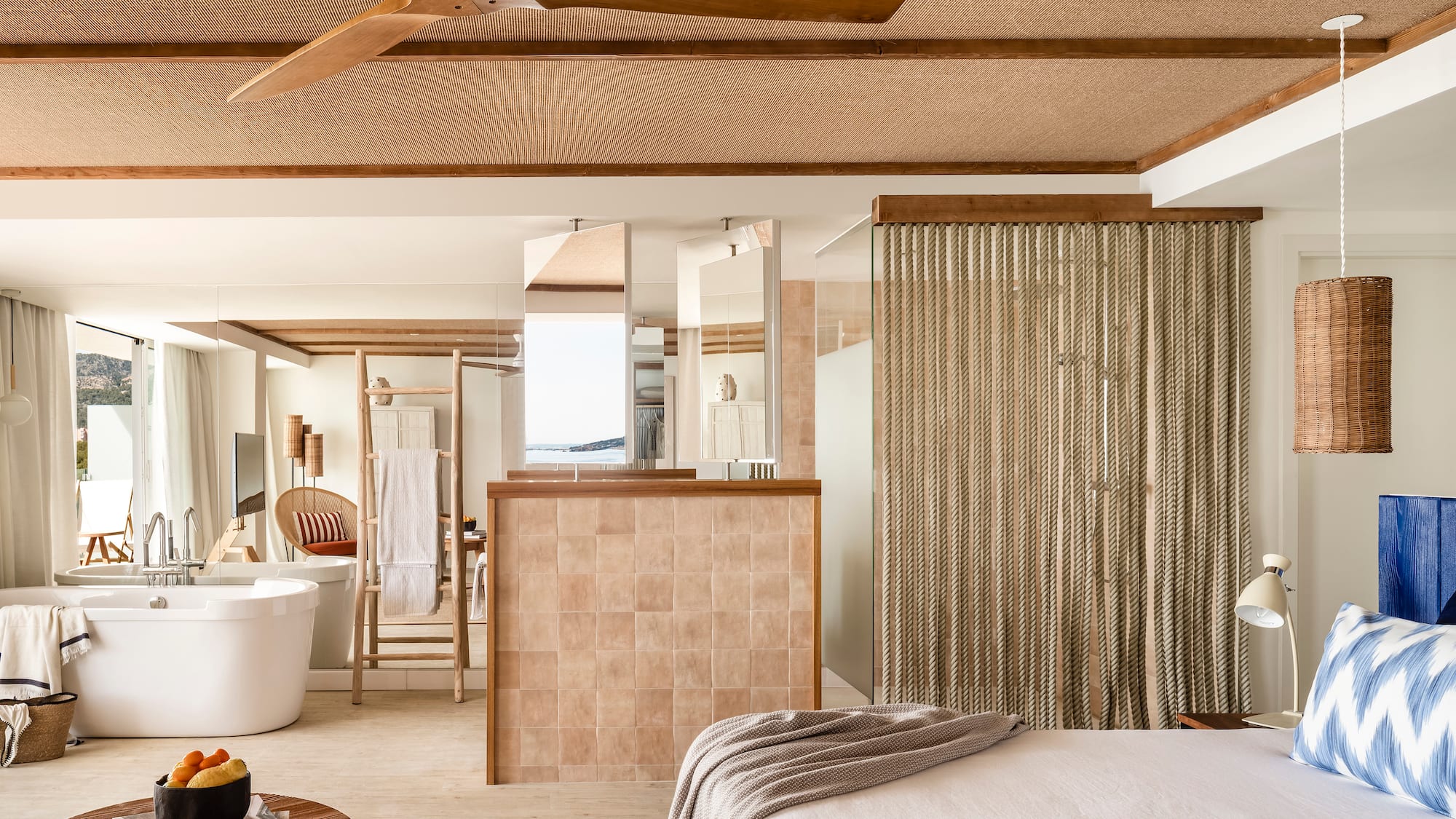 a room with a bed and a bathtub