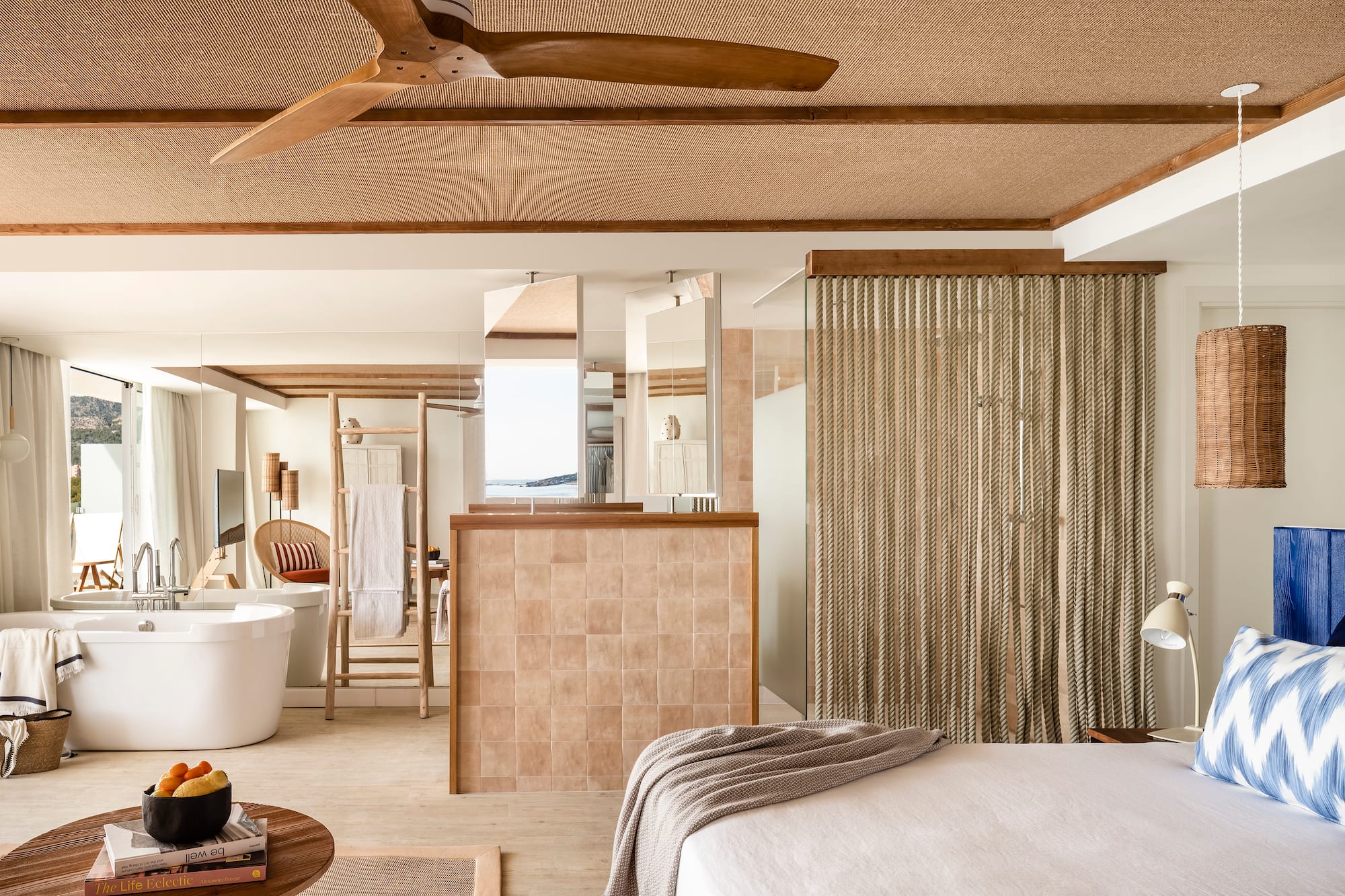 a room with a bed and a bathtub