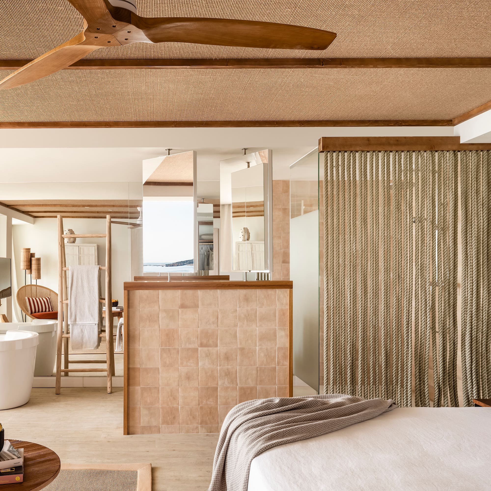 a room with a bed and a bathtub