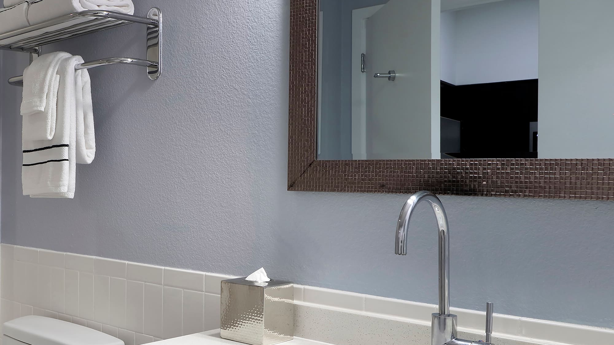 a bathroom with a mirror and sink