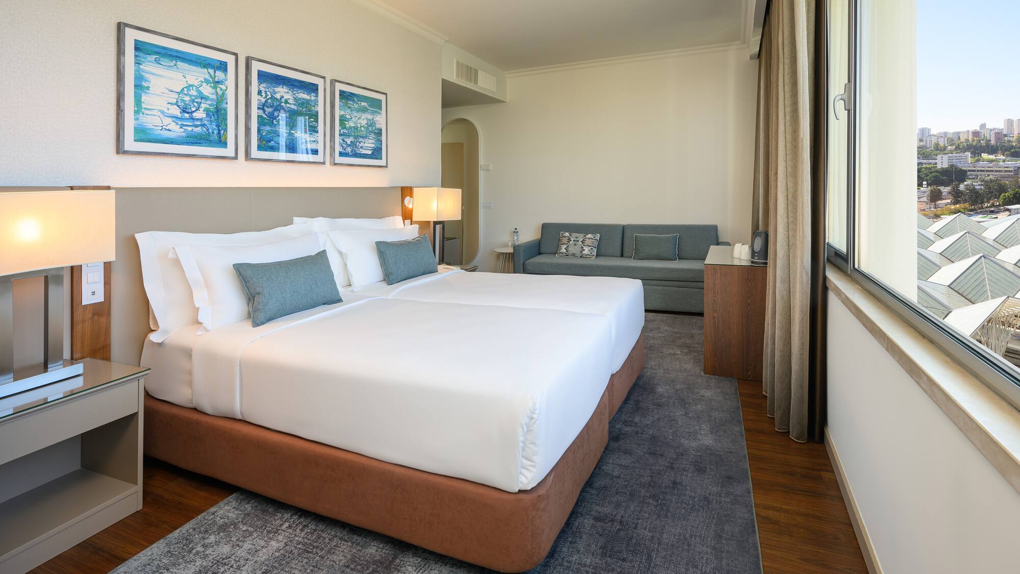 a room with two beds and a couch