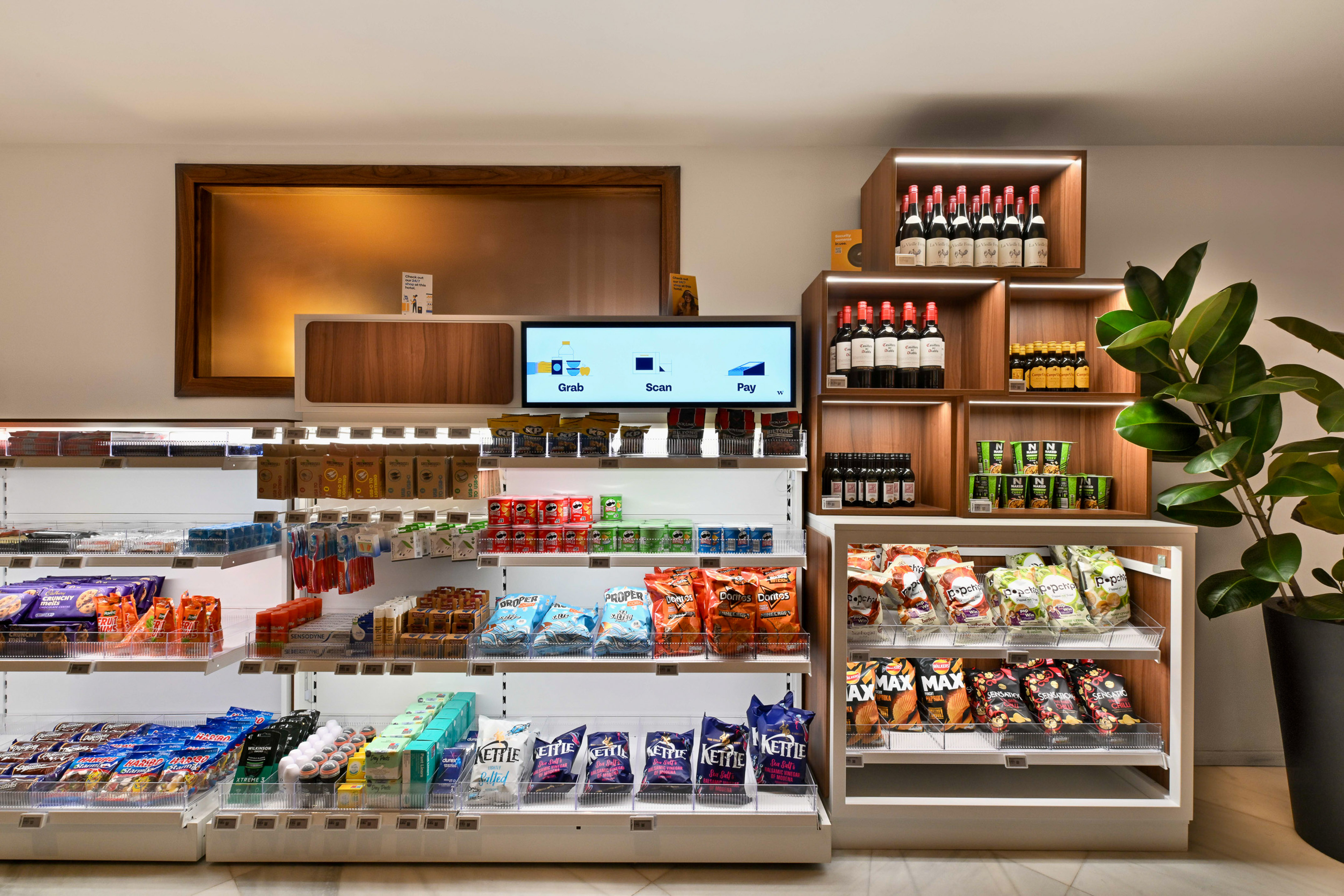 Grab-and-go self-service micro-market with snacks, drinks, and payment screen.