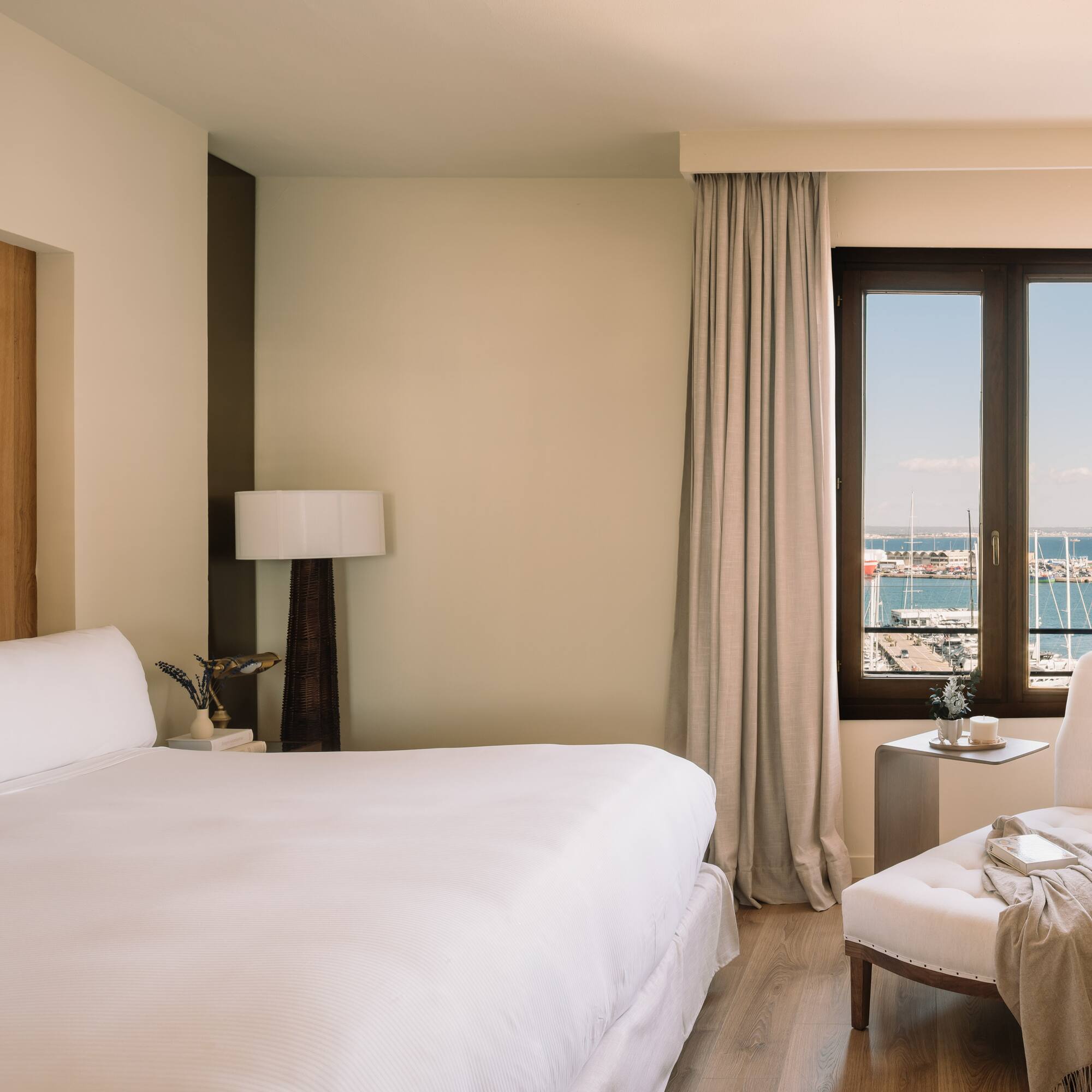 a bedroom with a bed and a chair