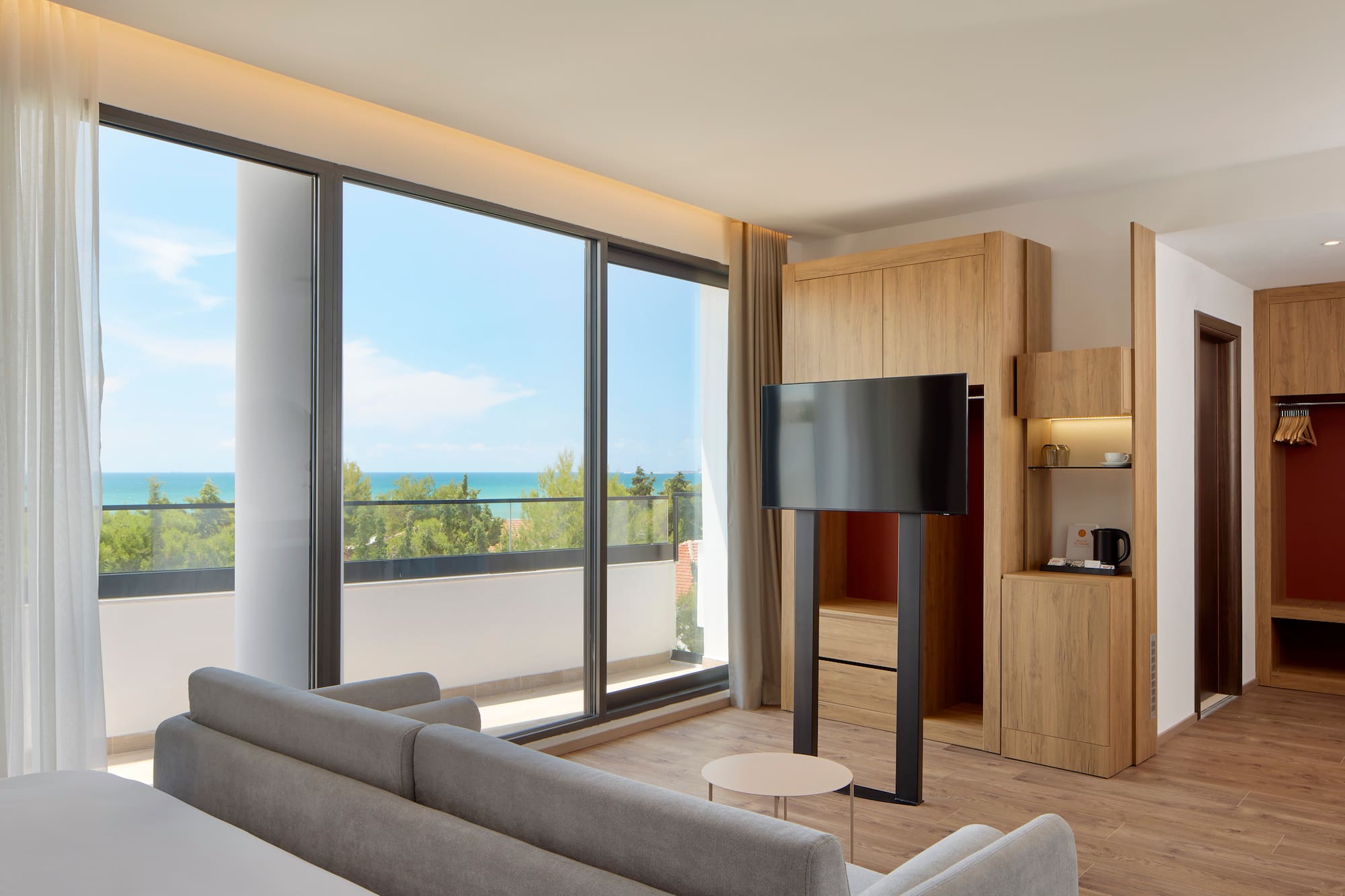 a room with a television and a large window