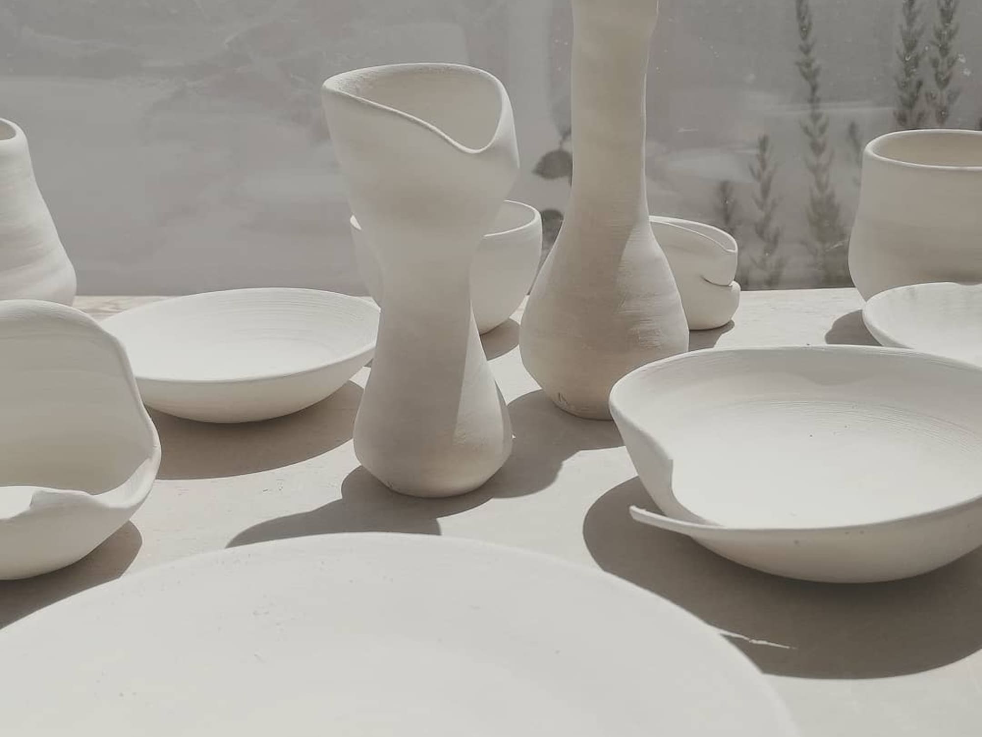 a group of white ceramic objects