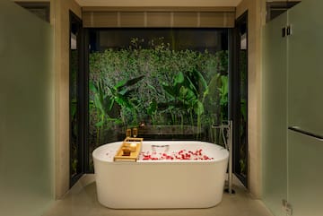a bathtub with flowers in it
