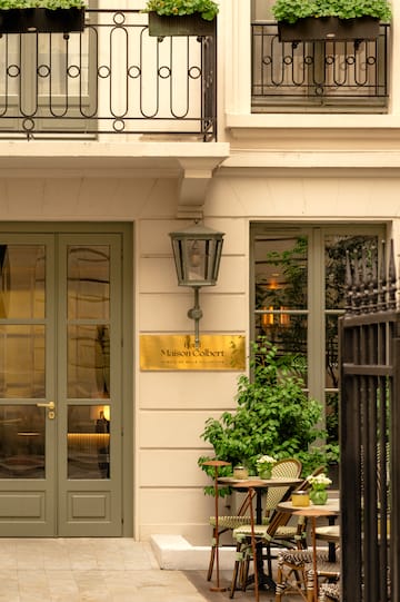 a building with a lamp and a table