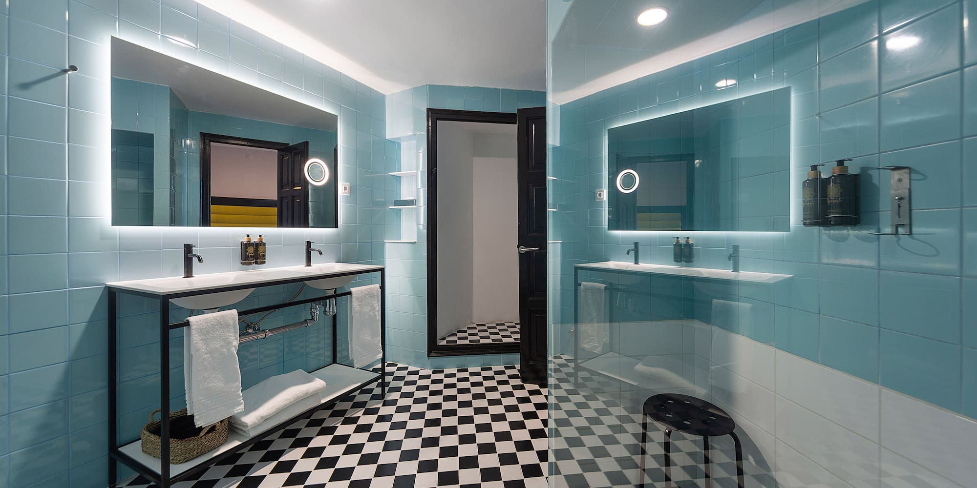 a bathroom with a mirror and a shower